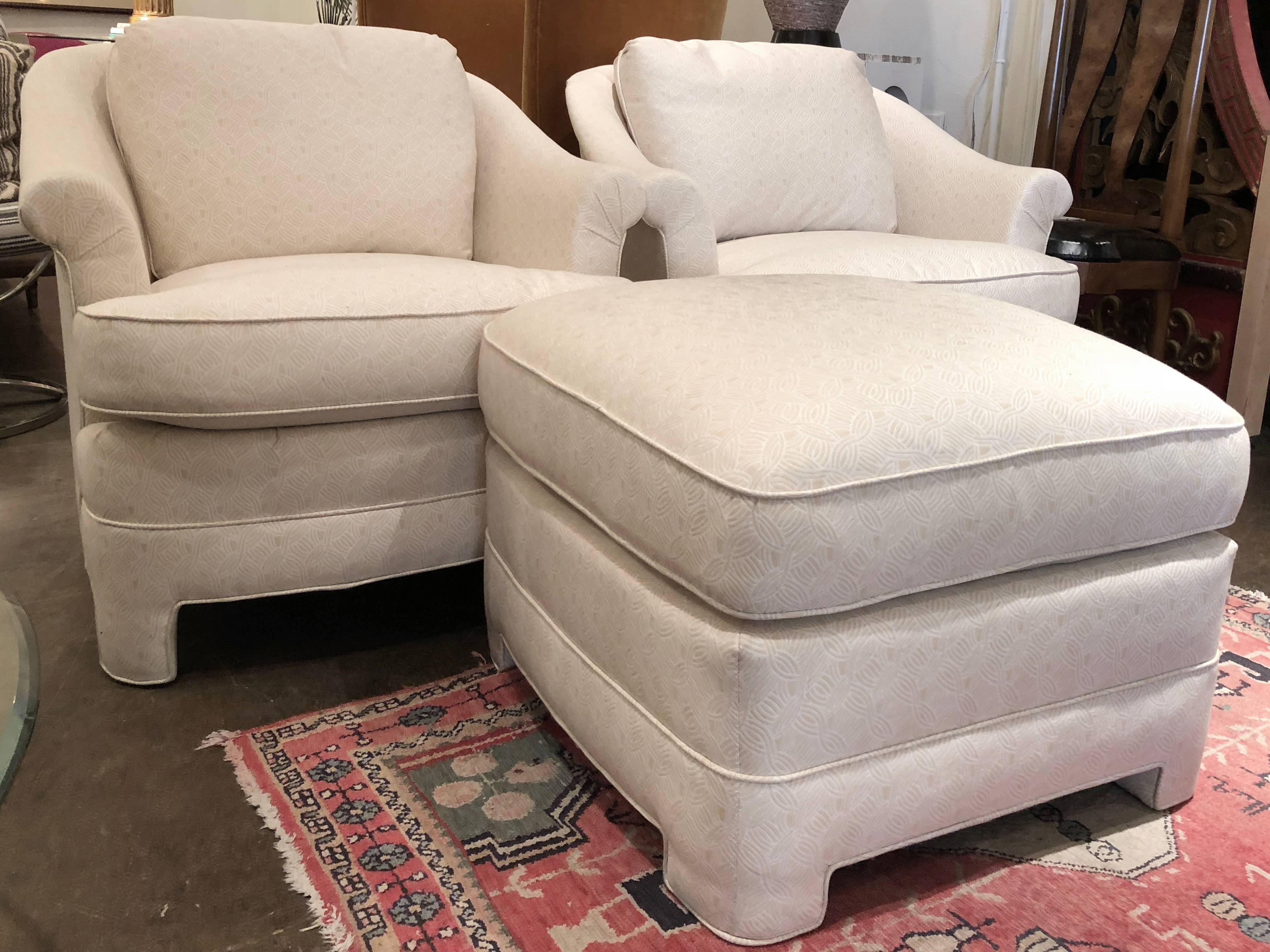 Pair of Henredon Asian influenced armchairs and ottoman. Newly upholstered in textured fabric. circa 1980s

dimensions: 32