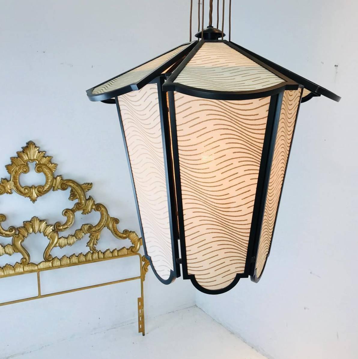Fortuny silk lantern pendant with bronze frame.

Dimensions: 19.6" dia x 20quot; T
48" overall in height.
mini base 8.3