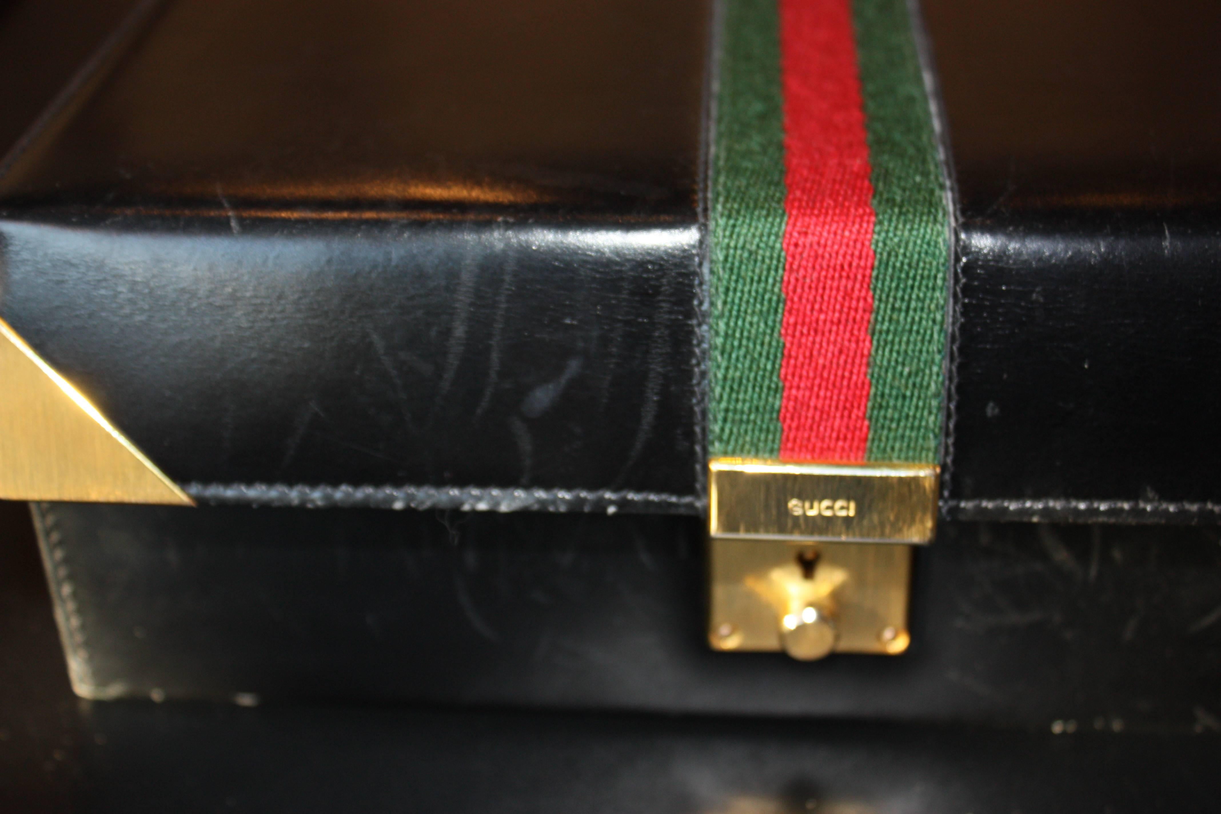 A vintage Gucci leather jewelry box.  Suede interior