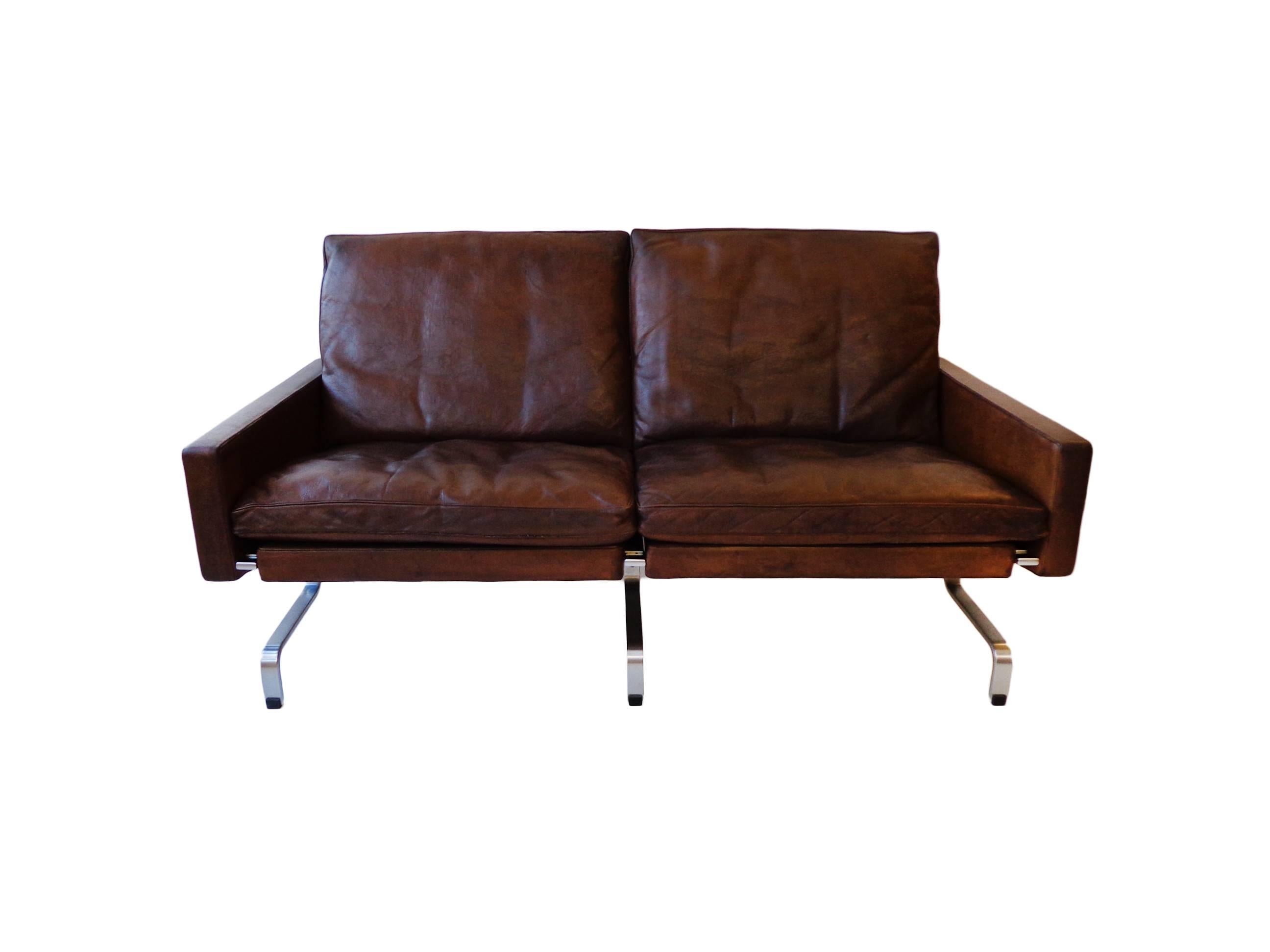 Offerd by Zitzo, Amsterdam: The sofa consisted steel side frames that included the front and back legs and were joined beneath the seat by a rectangular steel bar. Seat, back and side panels are coverd in original patinated leather.

Signed ith