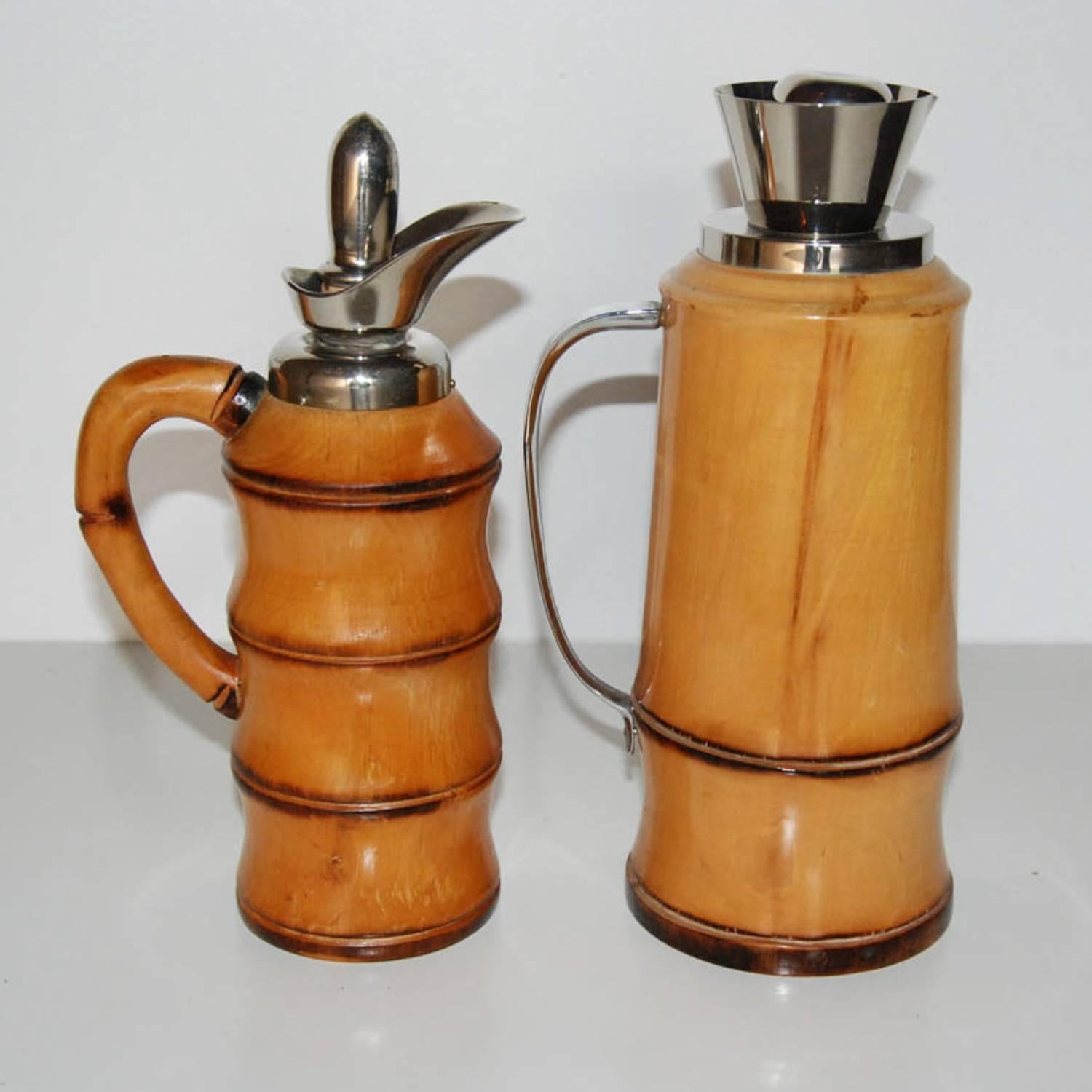 A pair of highly stylized bamboo inspired wood and chrome-plated cocktail shakers / decanters by Aldo Tura for Macabo. Excellent condition.