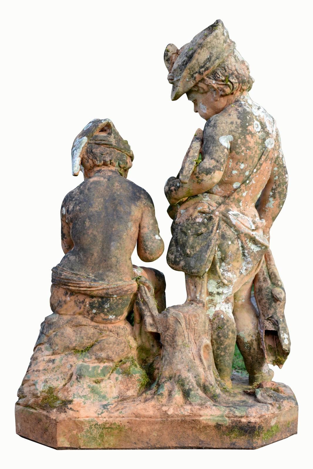 Dated from the second half of the 19th century, terra cotta group of children, 