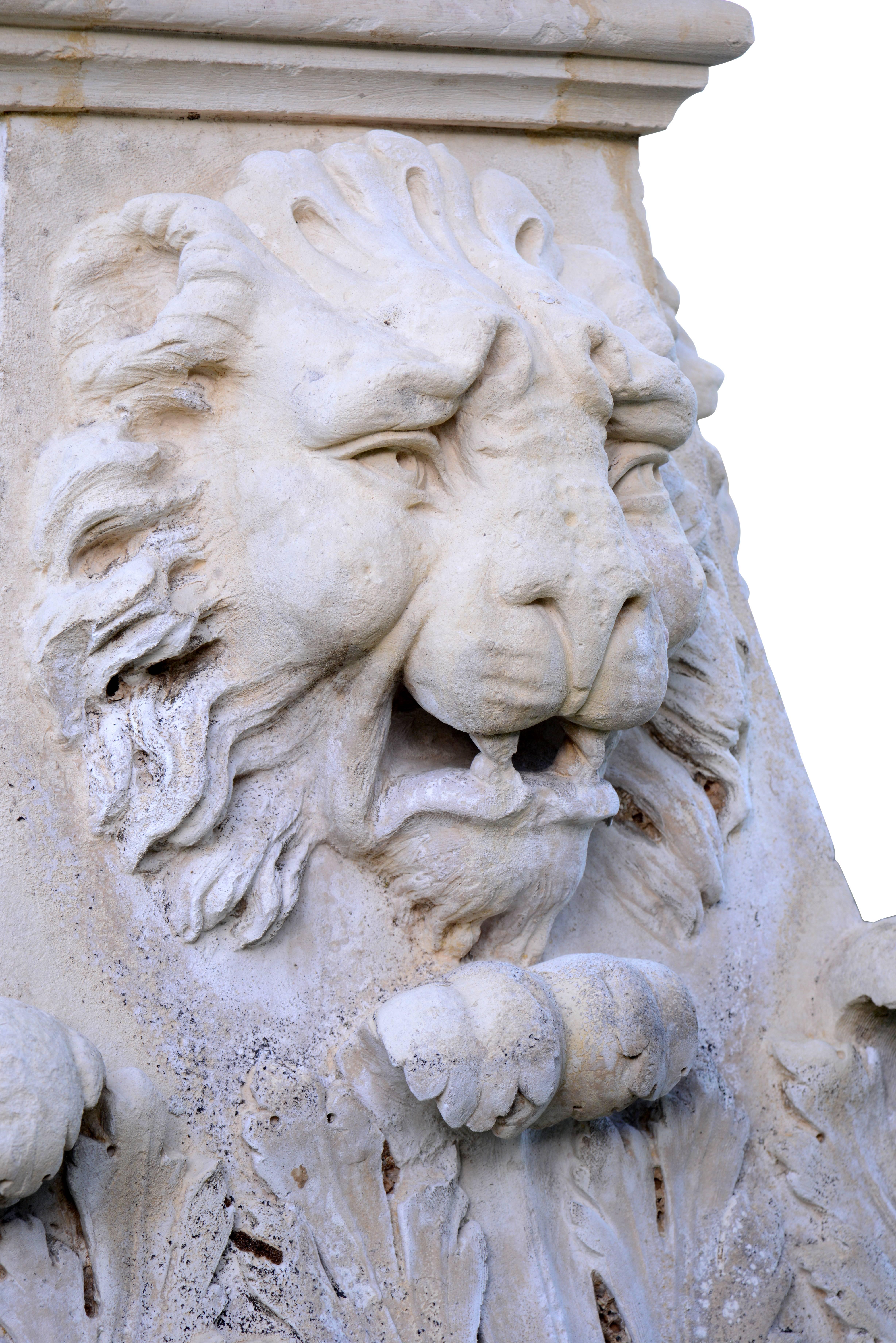 Dated from the 18th century, Louis XIV stone base. This is richly carved on the four faces, with lion-heads beneath which stand acanthus leaves. The upper part, with multiple setbacks, presents a decoration of channels. Restorations. The upper part: