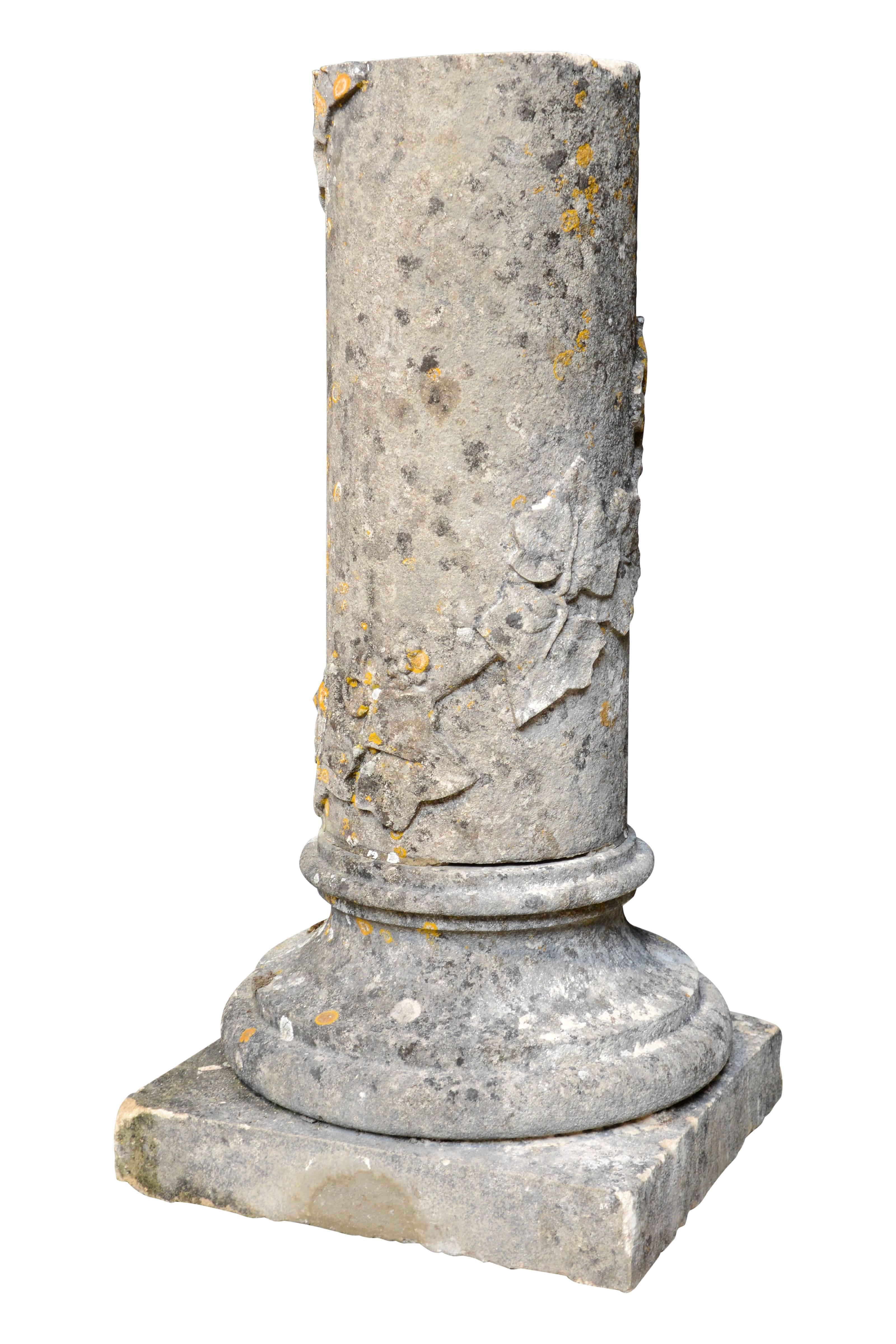 Dated from the 19th century, stone pedestal at the image of Roman column decorated with ivy leaves carved. Dimension of diameter: 10.6 in.