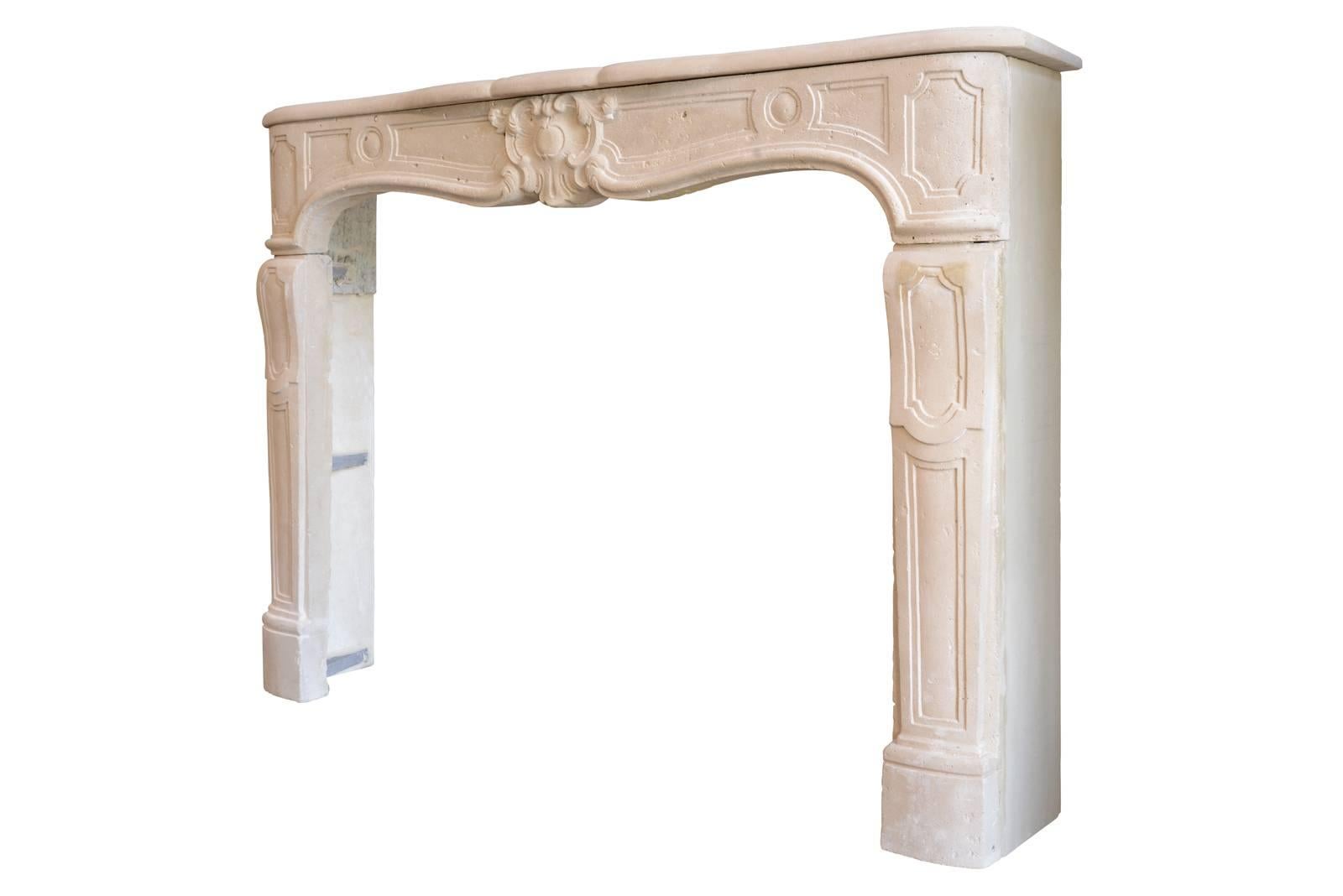 Carved French Louis XV Period Stone Fireplace, 18th Century