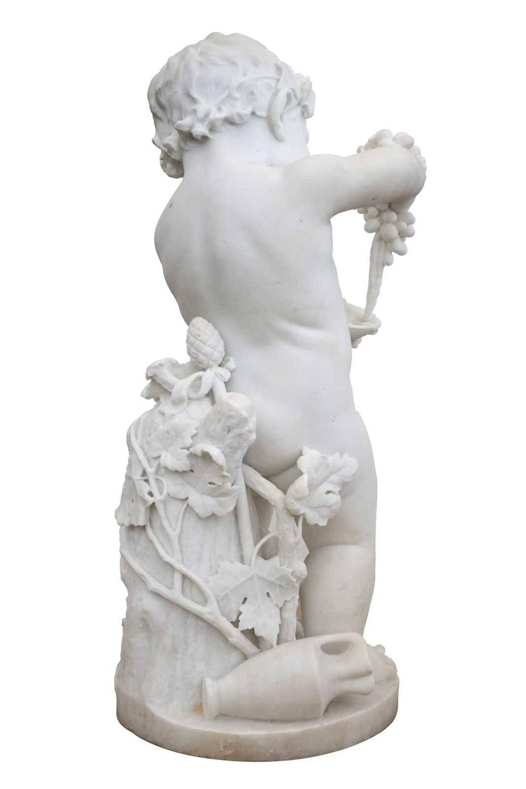 White marble statue of Bacchus or putto, dating from the 19th century. Very finely carved this statue presents a putto crowned with vine leaves, busy pressing grapes in a cup. In Greek mythology, it is common to see represented the god of wine
