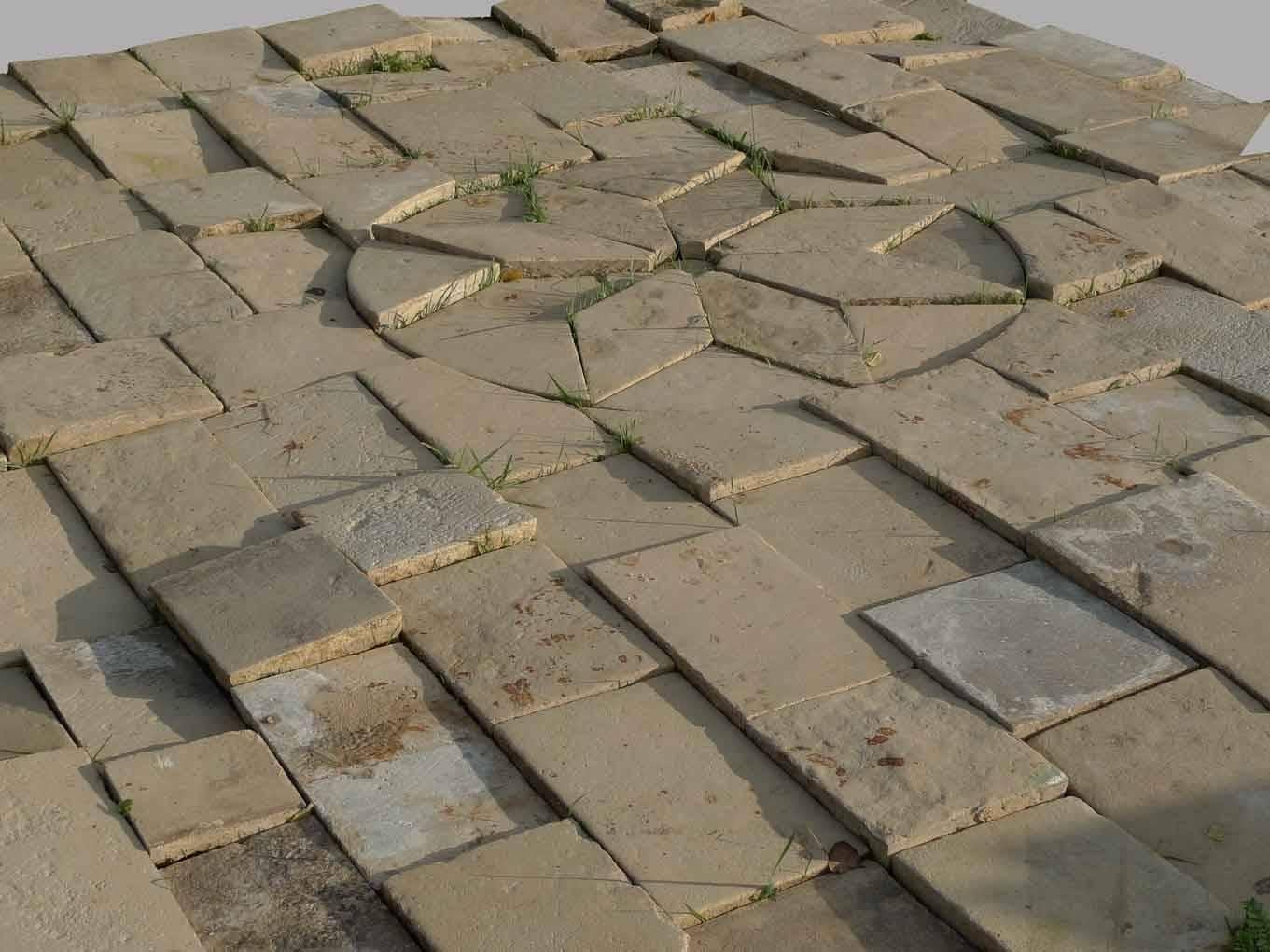 An important stone pavement animated by a median rosace for a rectangular room (183 x 200 in.). Early 18th C. Region of Poitiers.