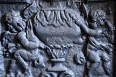 Plaque de cheminée en fonte représentant une allégorie de l'hiver, 19ème siècle