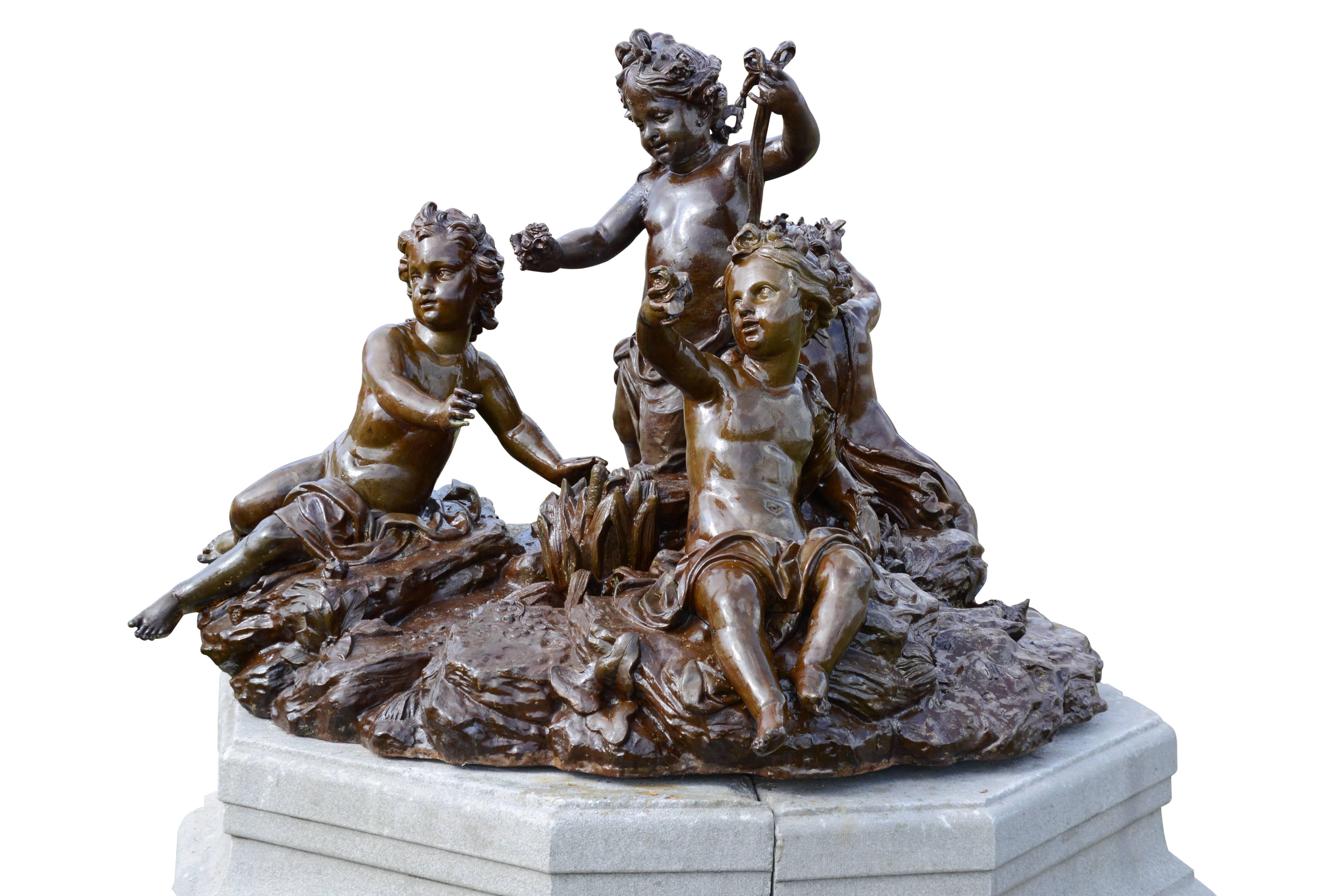 Louis XIV Important Cast Iron Group of Puttti Resting on a Granite Pedestal, 19th Century
