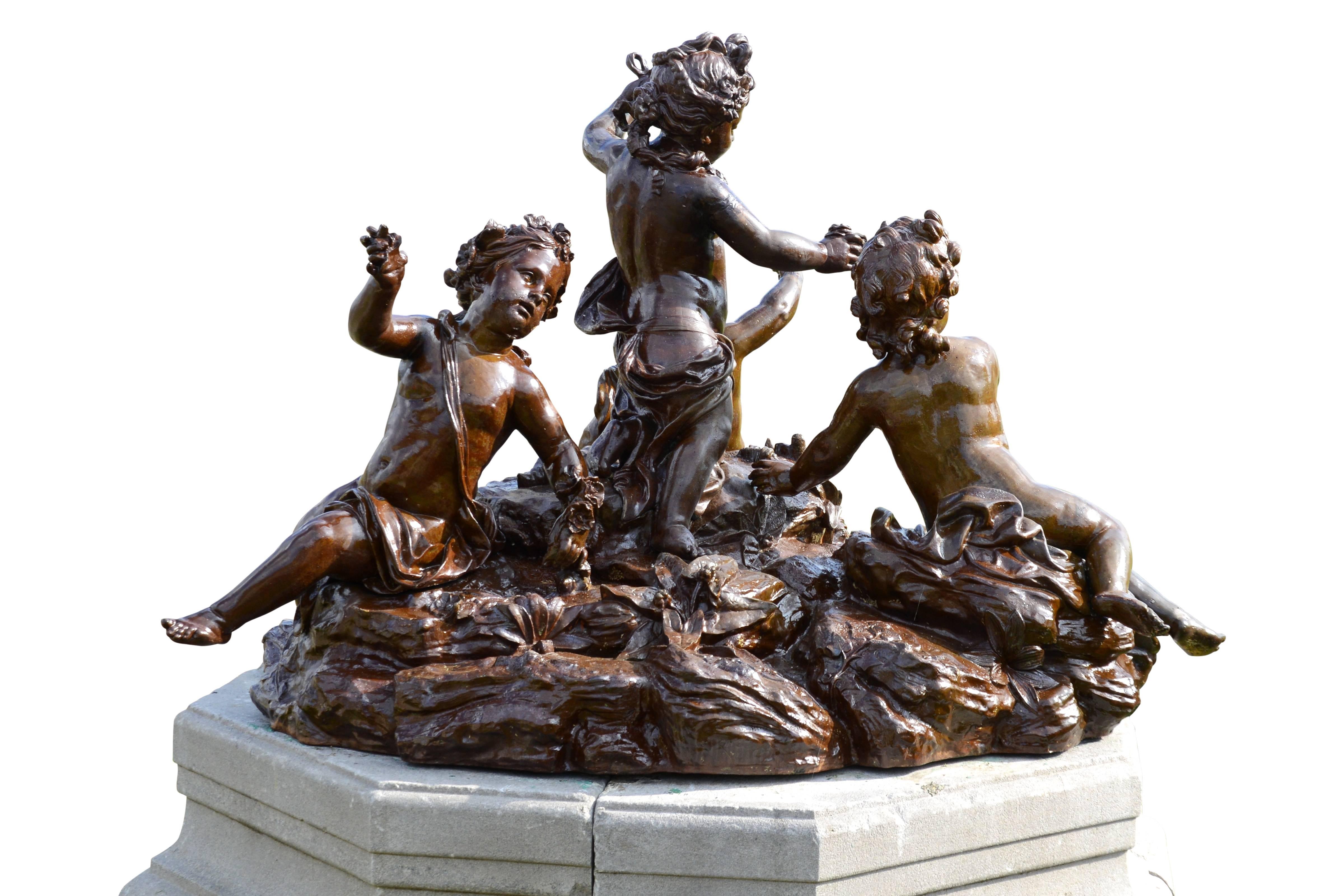 French Important Cast Iron Group of Puttti Resting on a Granite Pedestal, 19th Century