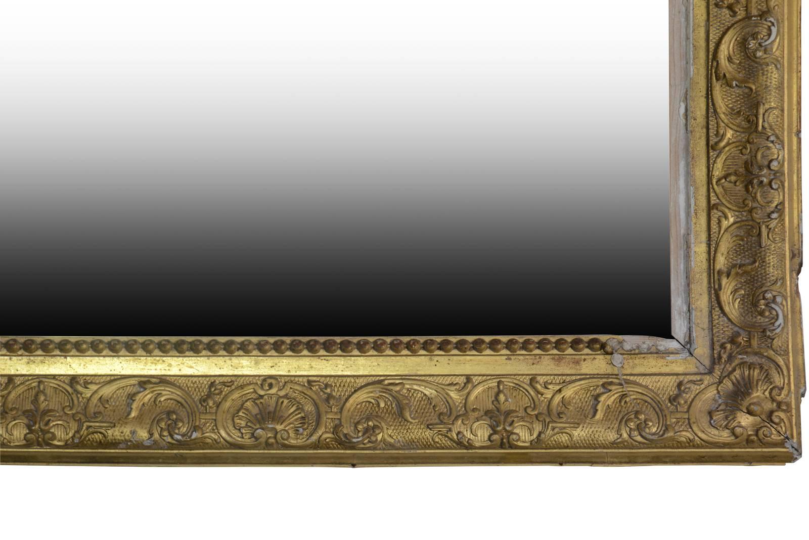 Dated from the 19th century, Empire mirror with molded and golden foliage with a small pearl frieze bordering the mirror. Little loses.