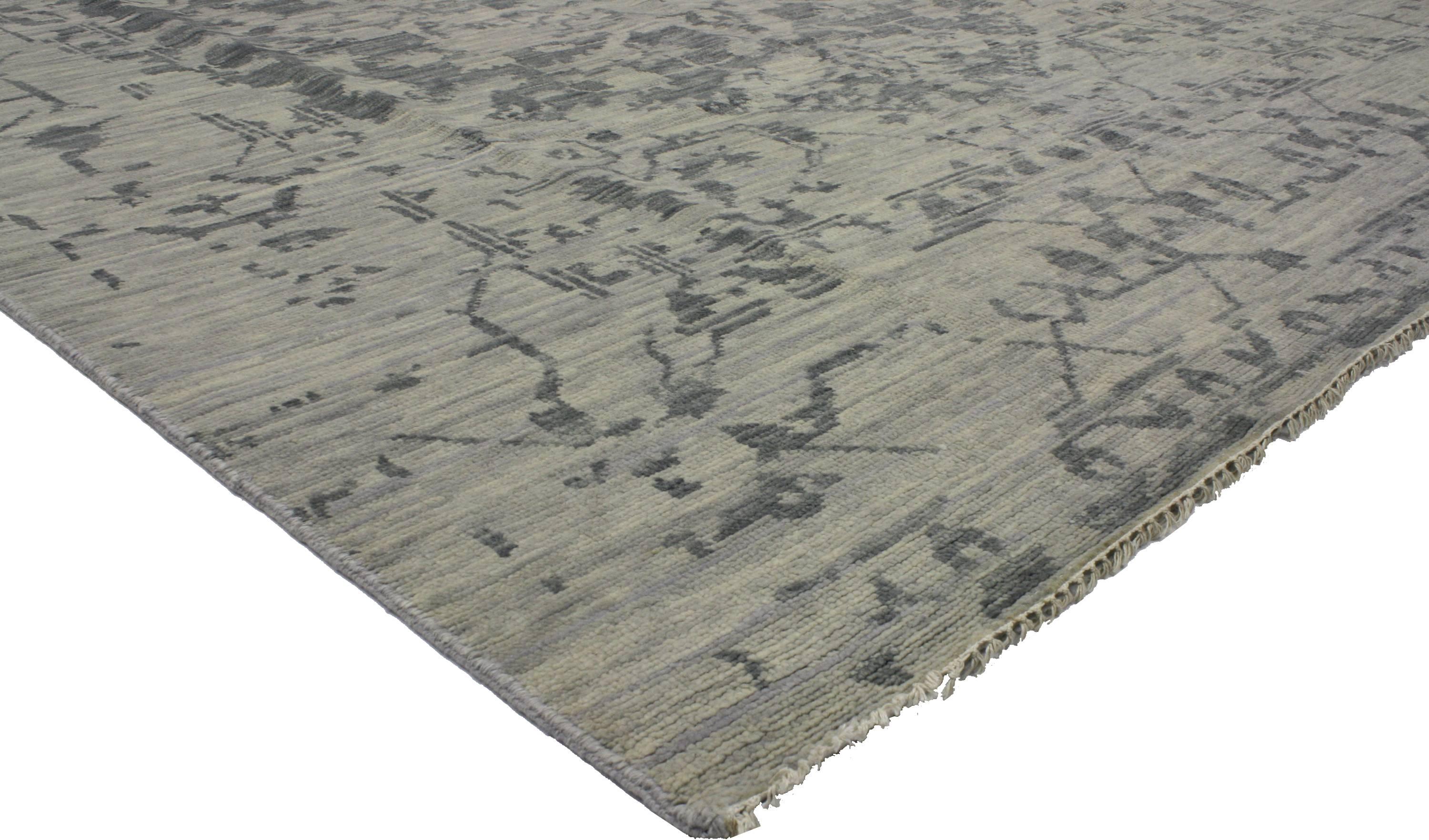 Give a time-honored look an energy infusion to your space with this modern gray rug. With its transitional style, erased design and variegated shades of gray, this hand-knotted wool rug can make a space feel polished, clean and calm. Going all-gray