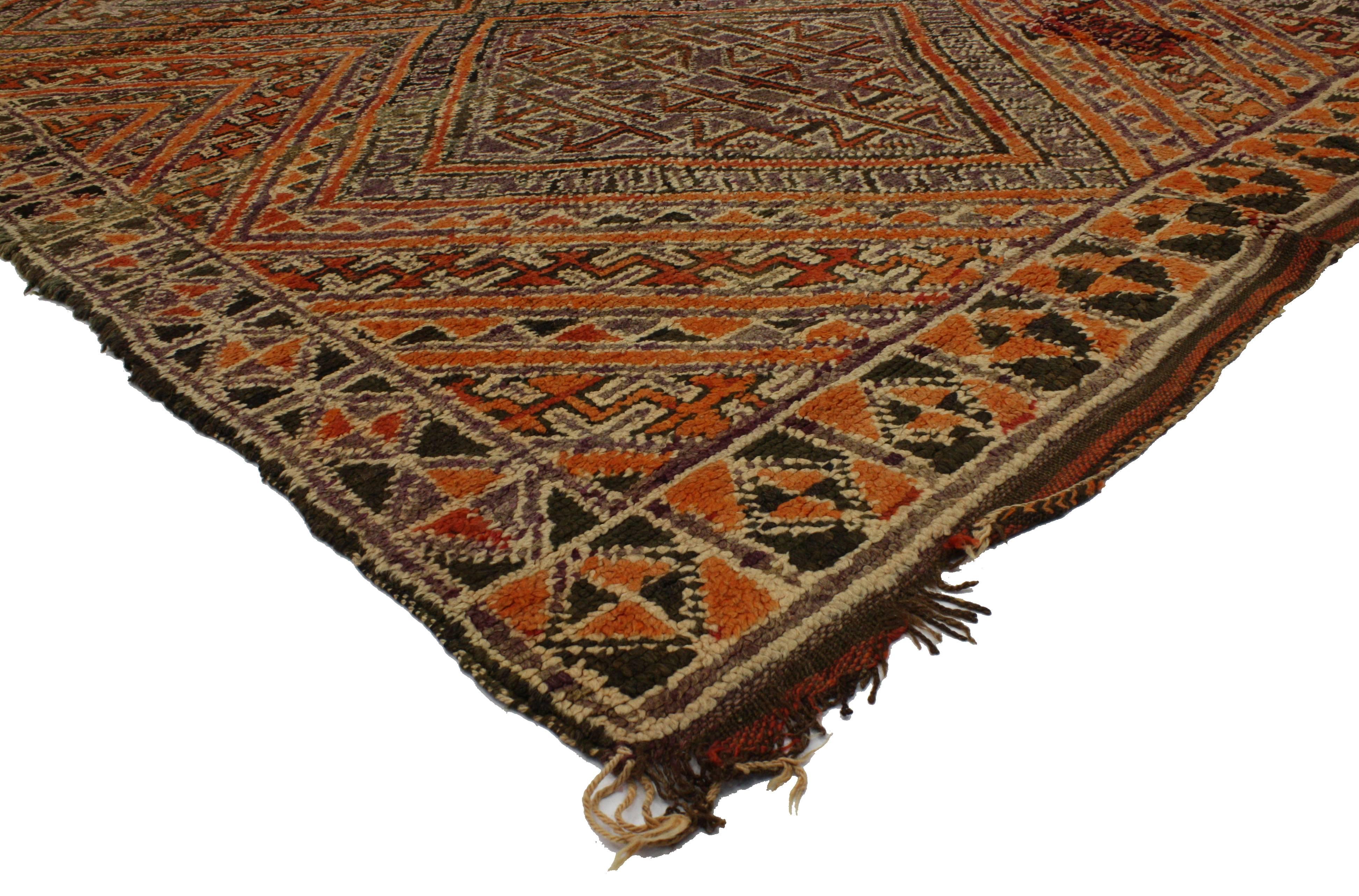 Recharge your space and brighten your home with this Berber Moroccan rug. An all-over geometric pattern and linear lines form a double diamond medallion. The patterns within patterns unfold with precision across the field producing a Primitive, yet