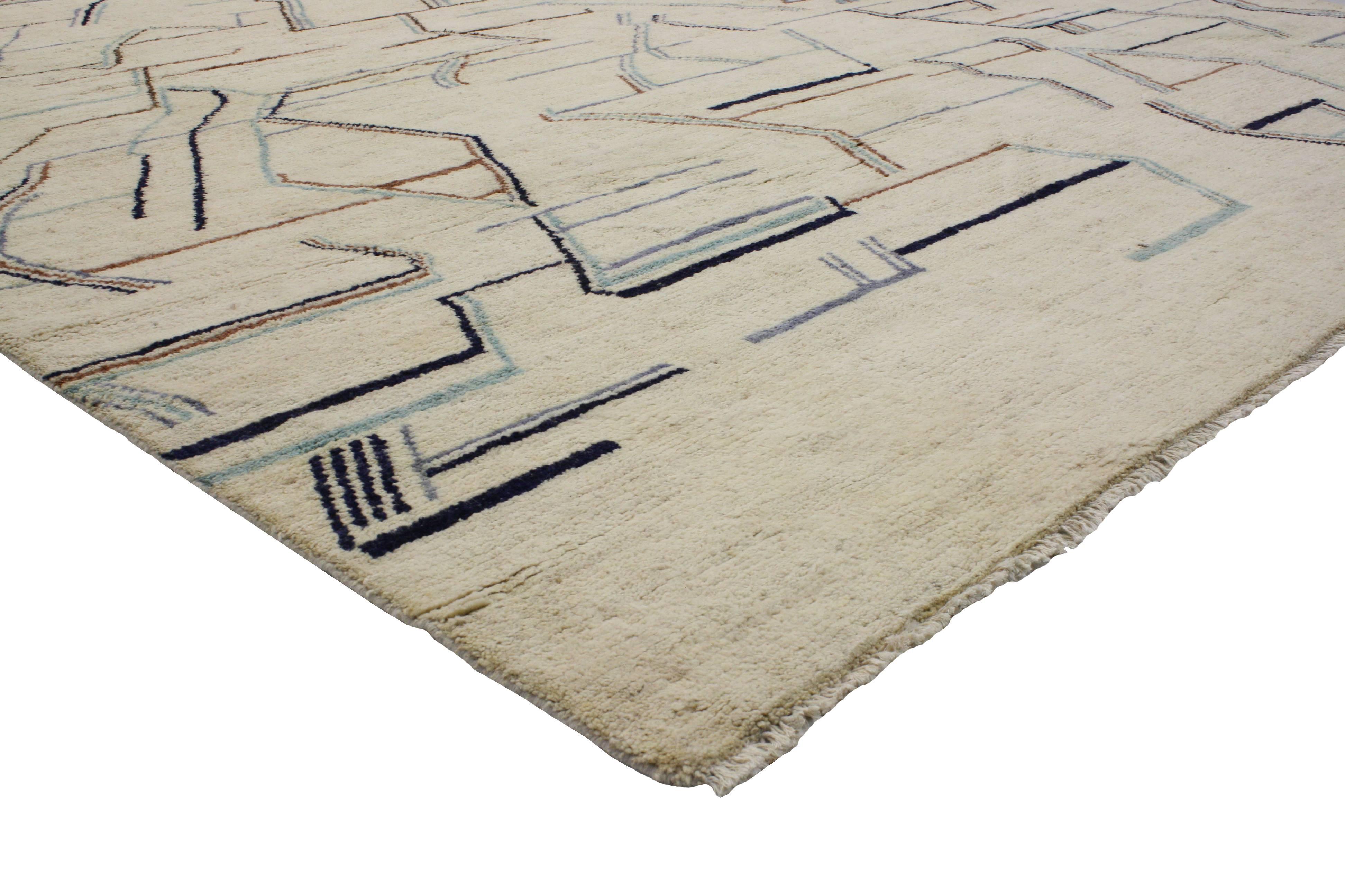 The free-form and abstract designs in this contemporary Moroccan style rug synthesize beautifully with modern style and add much-needed texture to nearly any interior. This handmade wool rug does an excellent job of communicating the finer points of