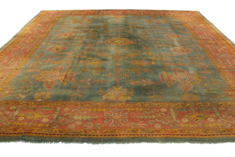 Antique Turkish Oushak Rug with TimeSoftened Jewel Tones and Modern