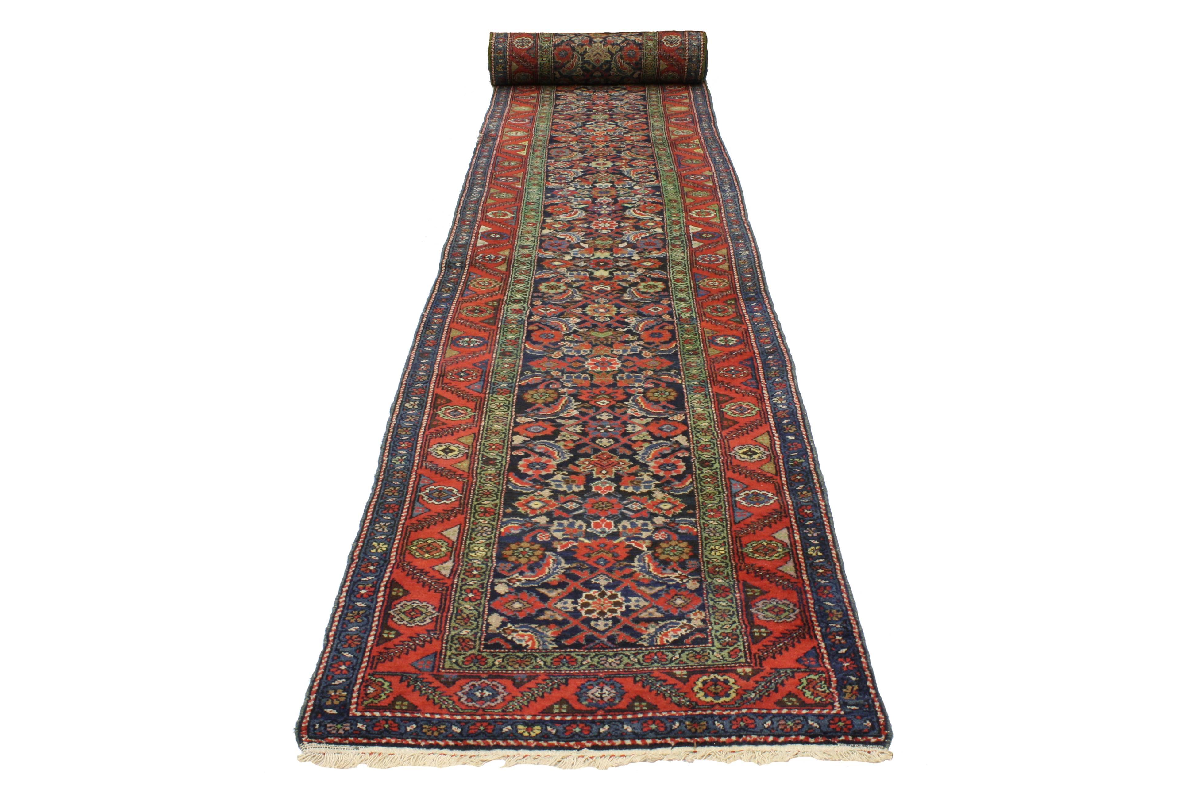 Create a comfortable and modern setting with this antique Persian Bibikabad carpet runner. With its impressively long length of 32 feet, this extra-long runner is perfect for stairs, long hallways, galleries and even boutique hotels. Featuring a