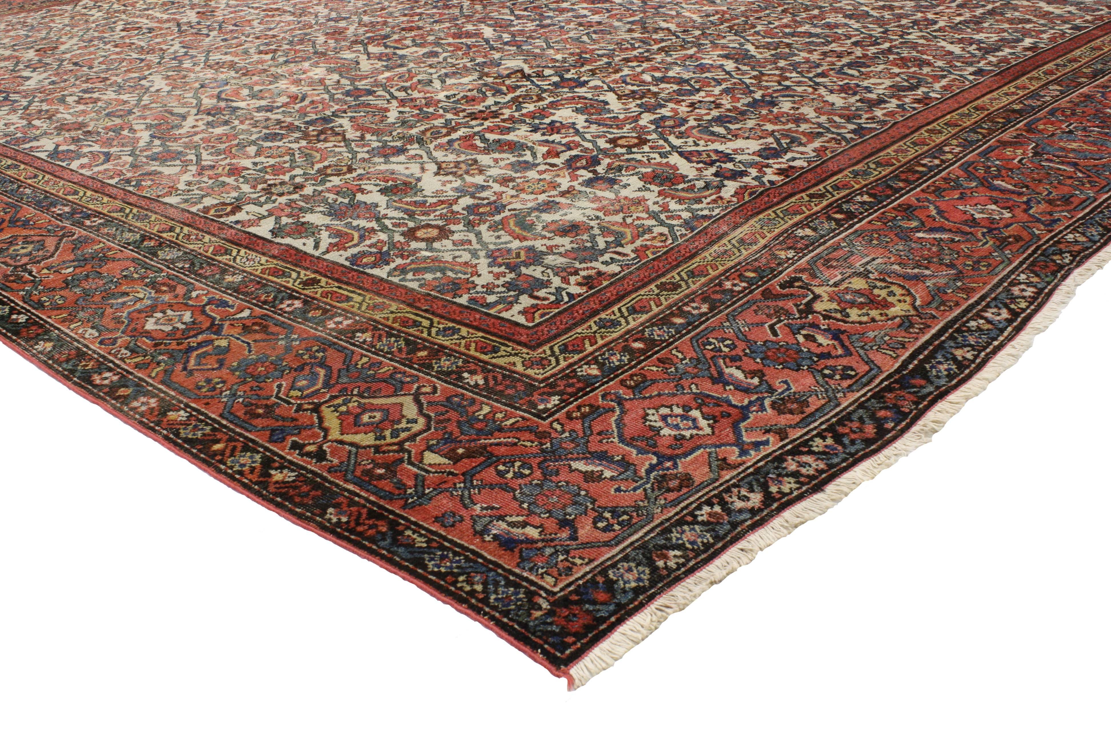 76790 Late 19th Century Distressed Antique Persian Mahal Rug with Rustic English Traditional Style 13'08 x 15'09. With timeless elegance and nostalgic charm, this hand knotted wool late 19th century distressed antique Persian Mahal palace rug can