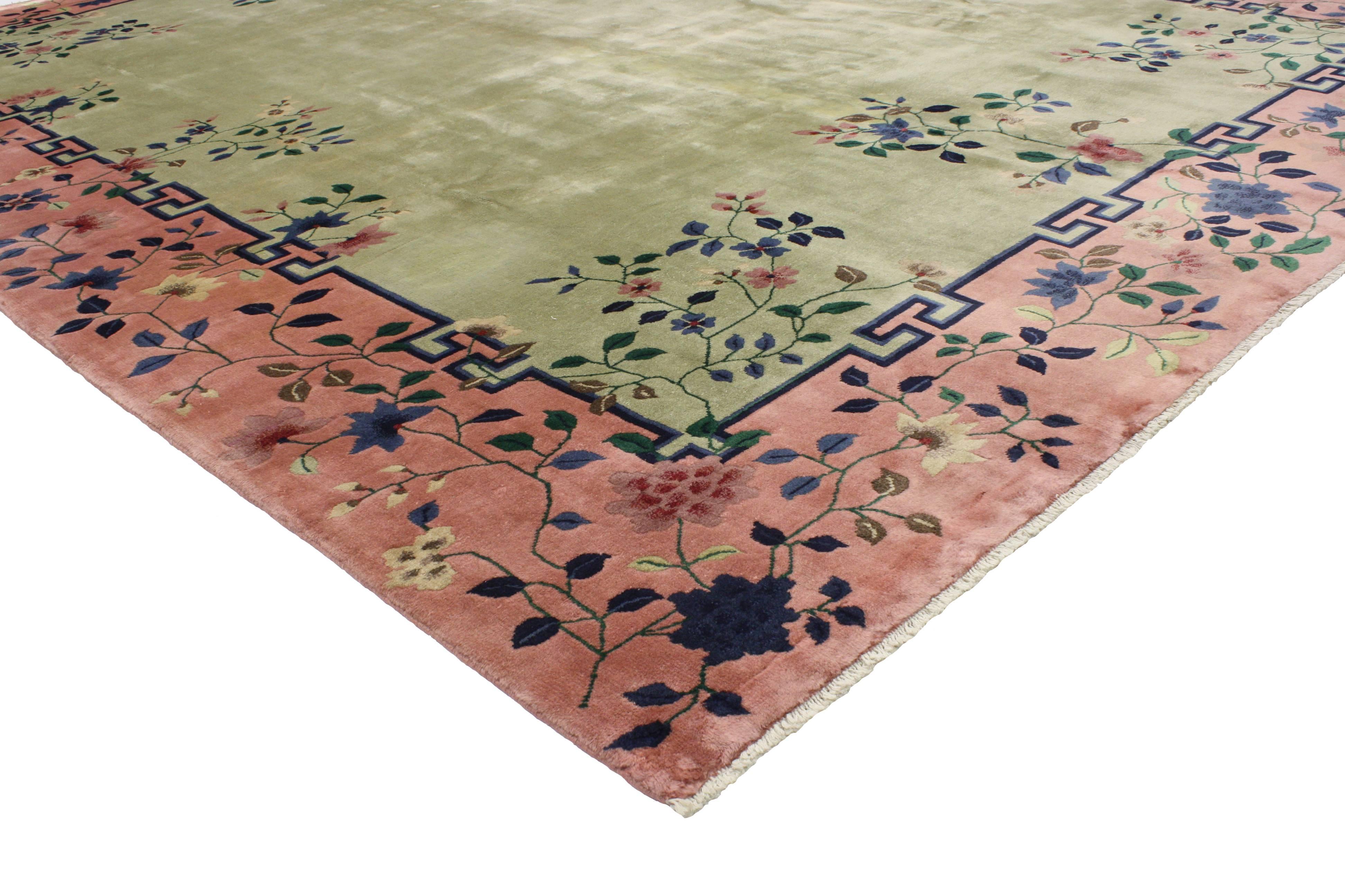 Revitalize your space with this 1920s Chinese Art Deco rug, attributed to Walter Nichols. A striking mix of an ornate floral pattern and high contrast colors, this Art Deco rug is bold and beautiful. Featuring Classic Chinese style and whimsical