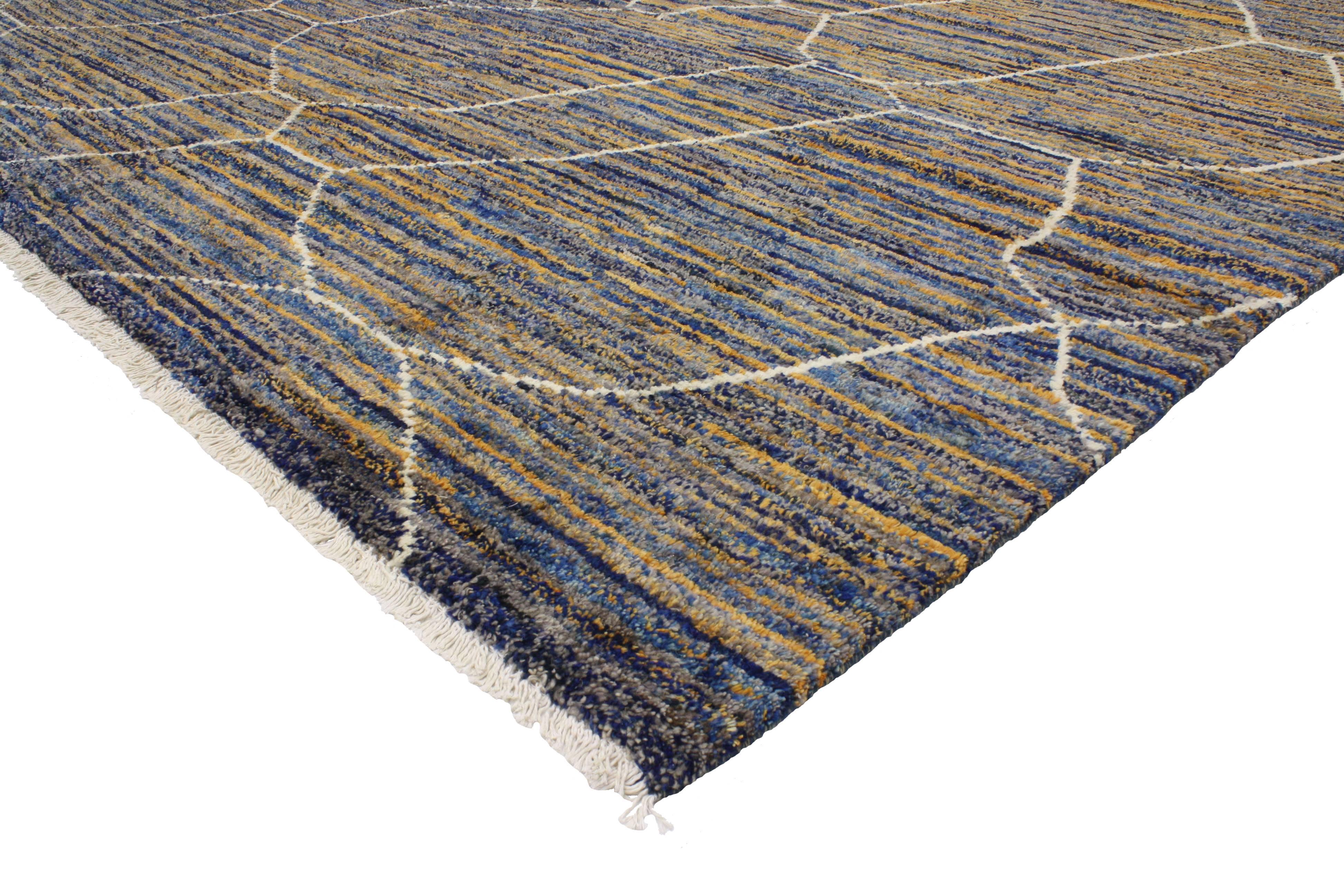 Infuse your space with this contemporary Moroccan style rug with abstract design. Saturated in an extraordinary palette of blue and orange, this Moroccan style rug showcases true simplistic style with a punch of color. The asymmetrical lines in this