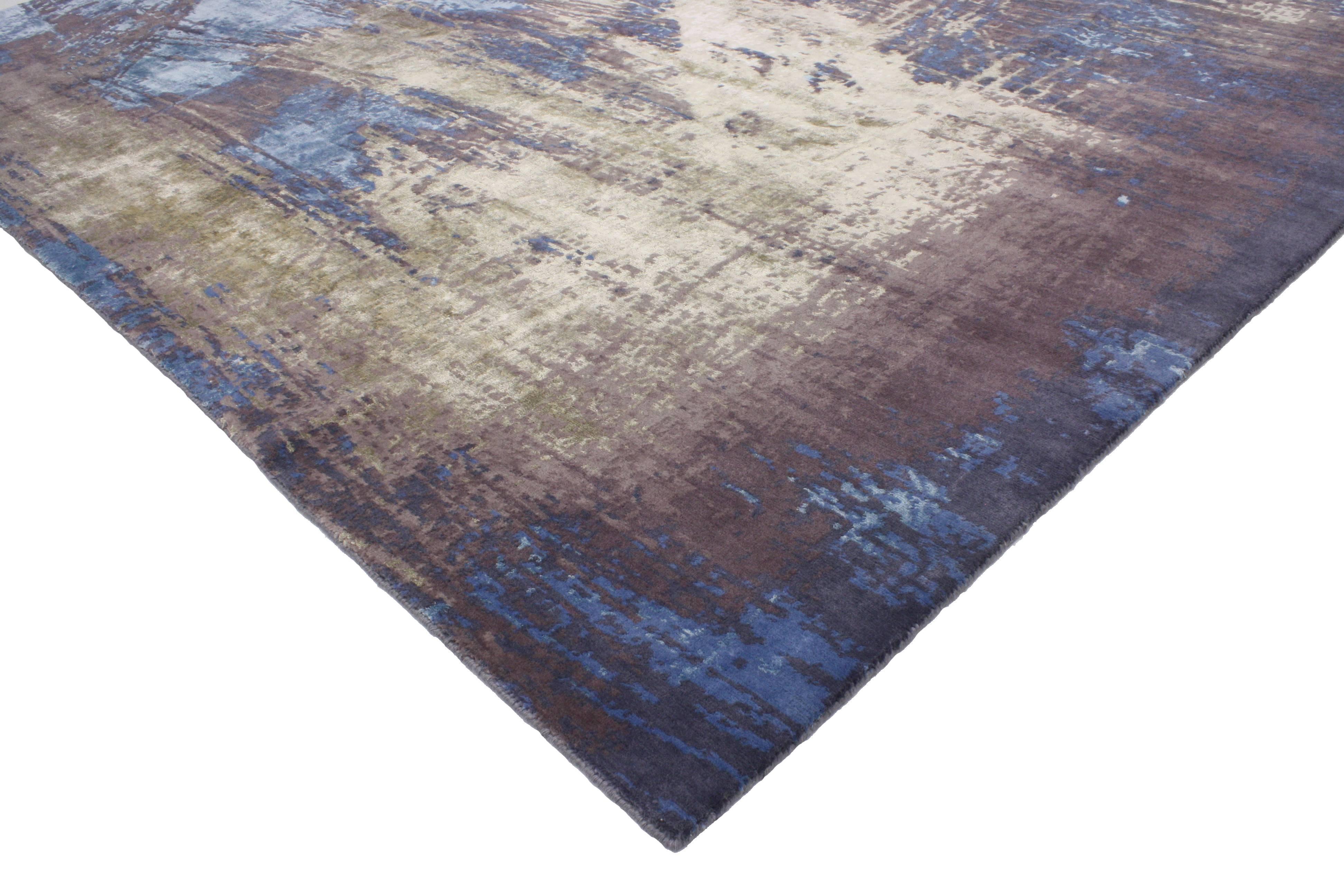 This Modern style rug with contemporary abstract scratch texture is a mix of contemporary genius, with funky, original and a good pop of color. The striated, smoky field of cornflower blue is dappled with rich strokes of purple-gray, sage green and