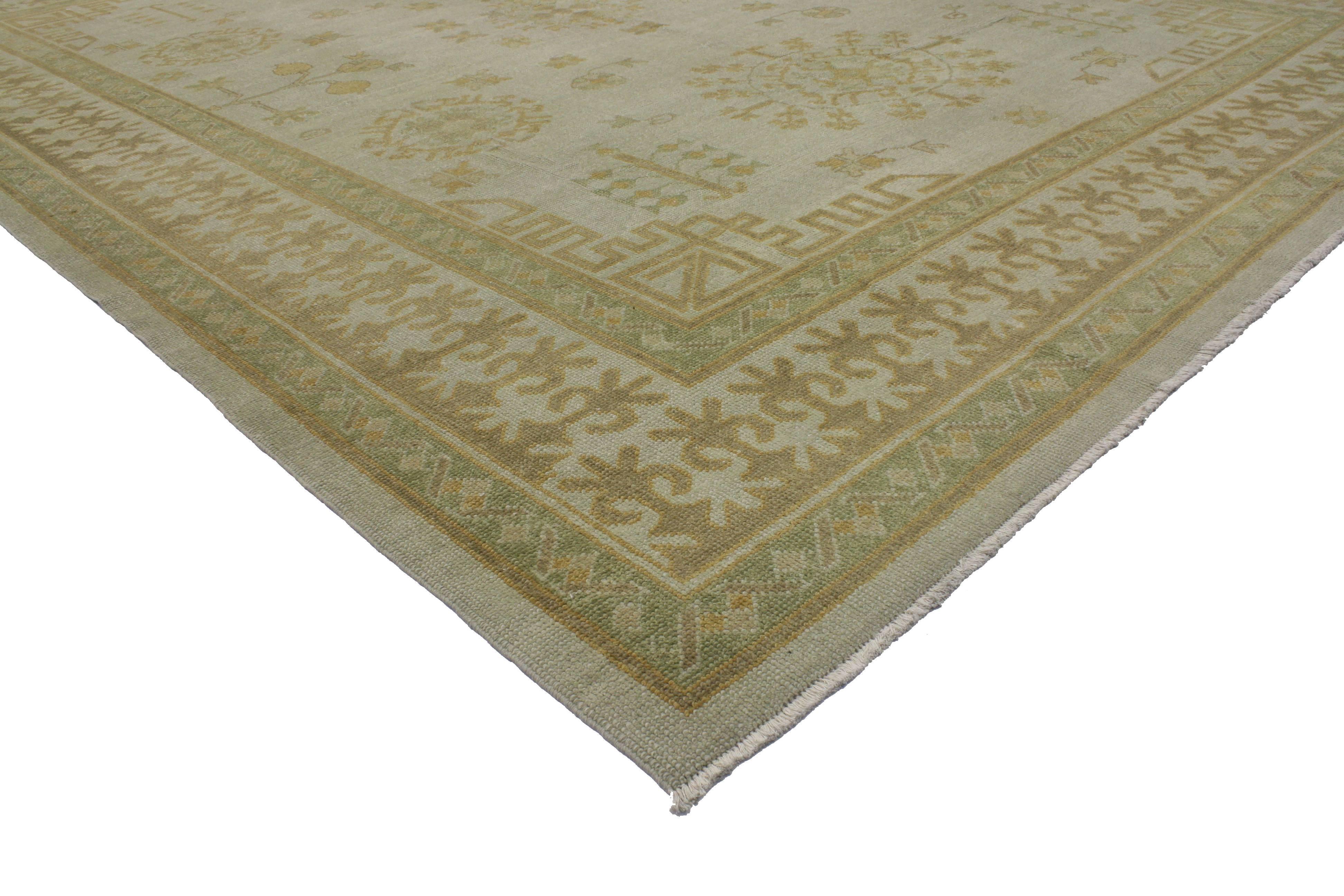 This modern Turkish Oushak rug features a transitional style and casual elegance. The meticulous details radiate throughout the well-balanced composition creating a compelling framework unfolding a beautiful patina. This Oushak rug possesses an