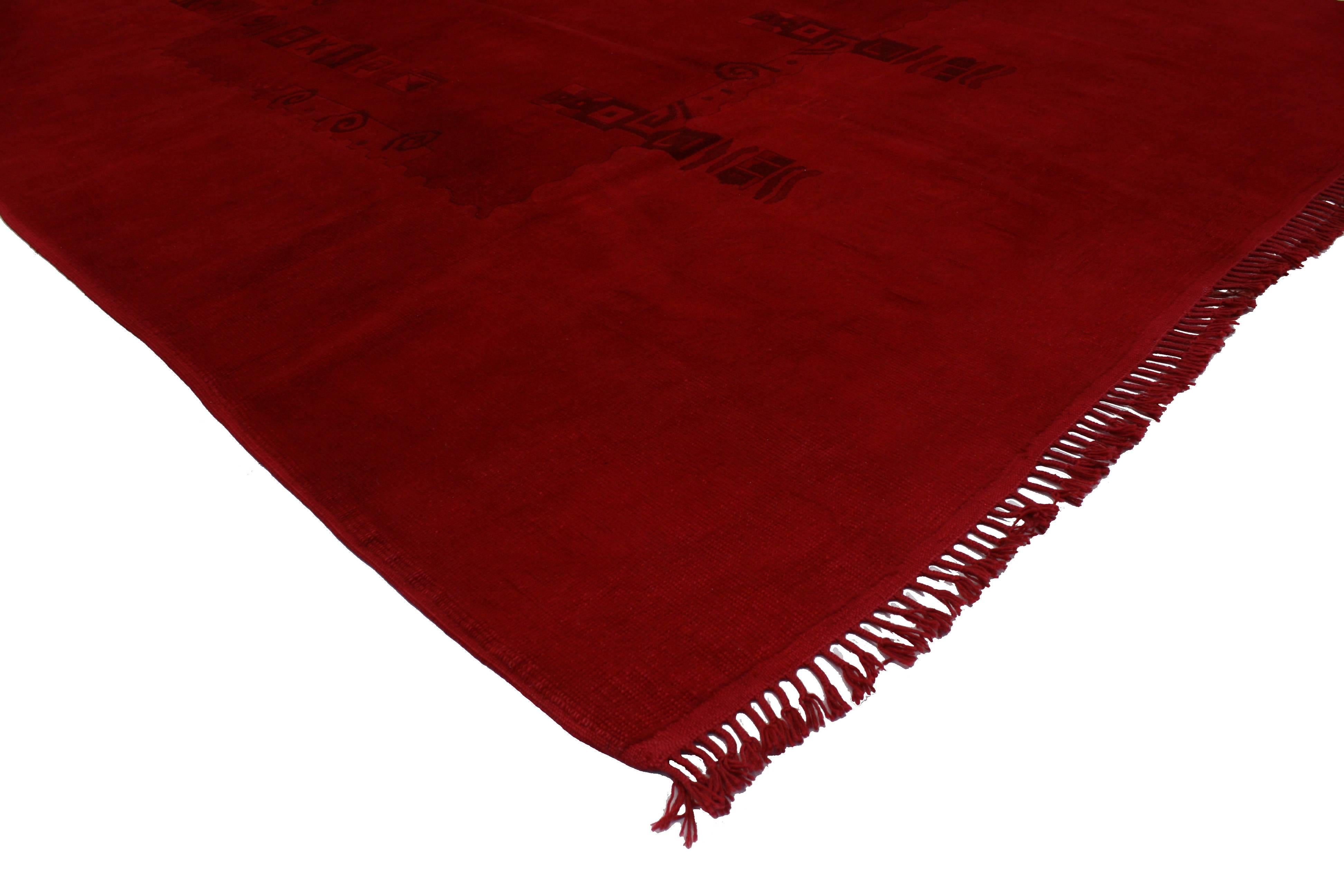 This vintage Turkish Oushak rug overdyed in red with Contemporary Modern style bears a remarkable air of chic sophistication. Traditional style with a modern twist. This balancing effect of modern design with a saturated red color evoke the interior