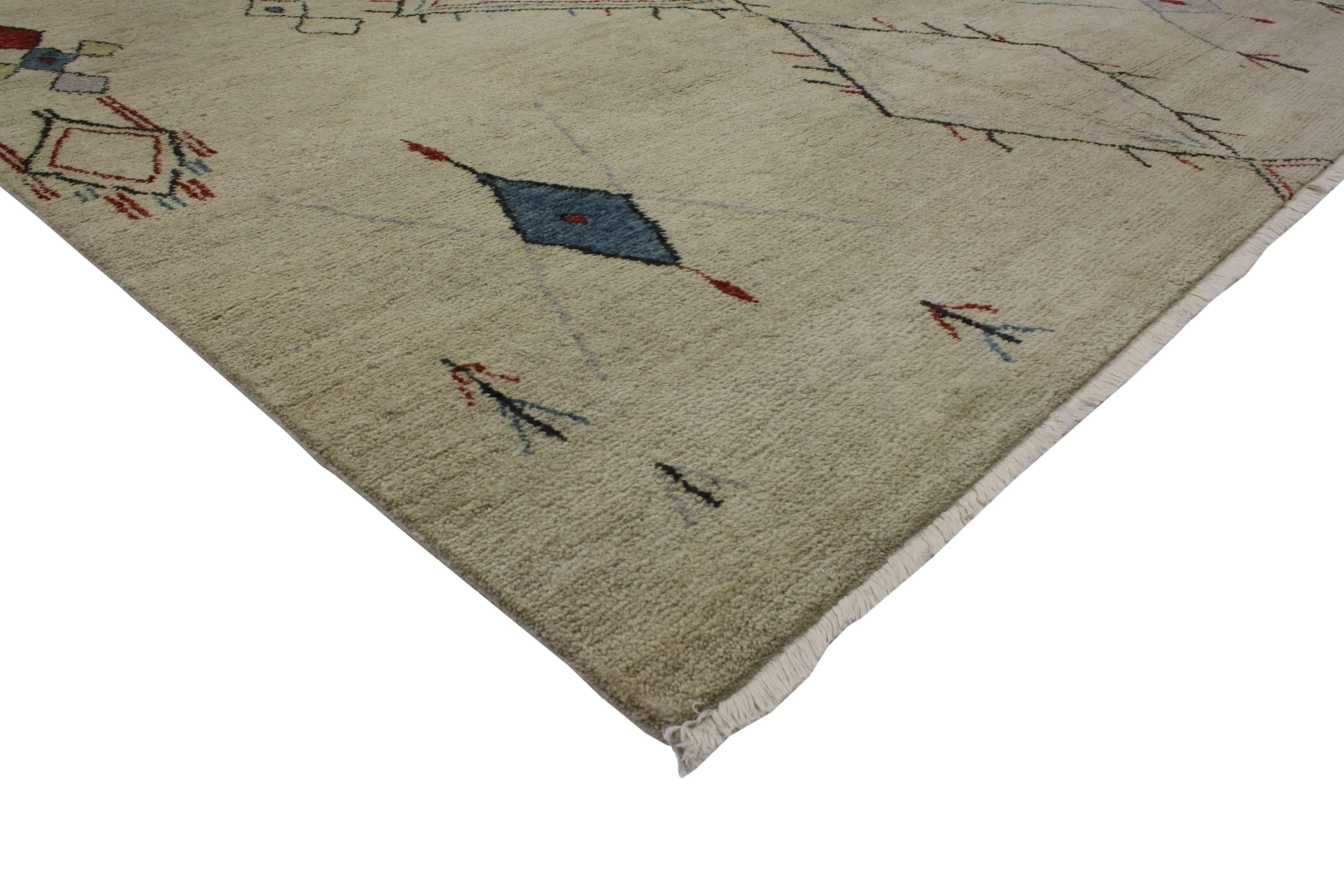 With its stylish levels of complexity combined with Folk Art creativity, this Contemporary Moroccan style area rug is an impeccable representation of Modern Tribal Design in the 21st century. The free-form tribal motifs beautifully synthesize with