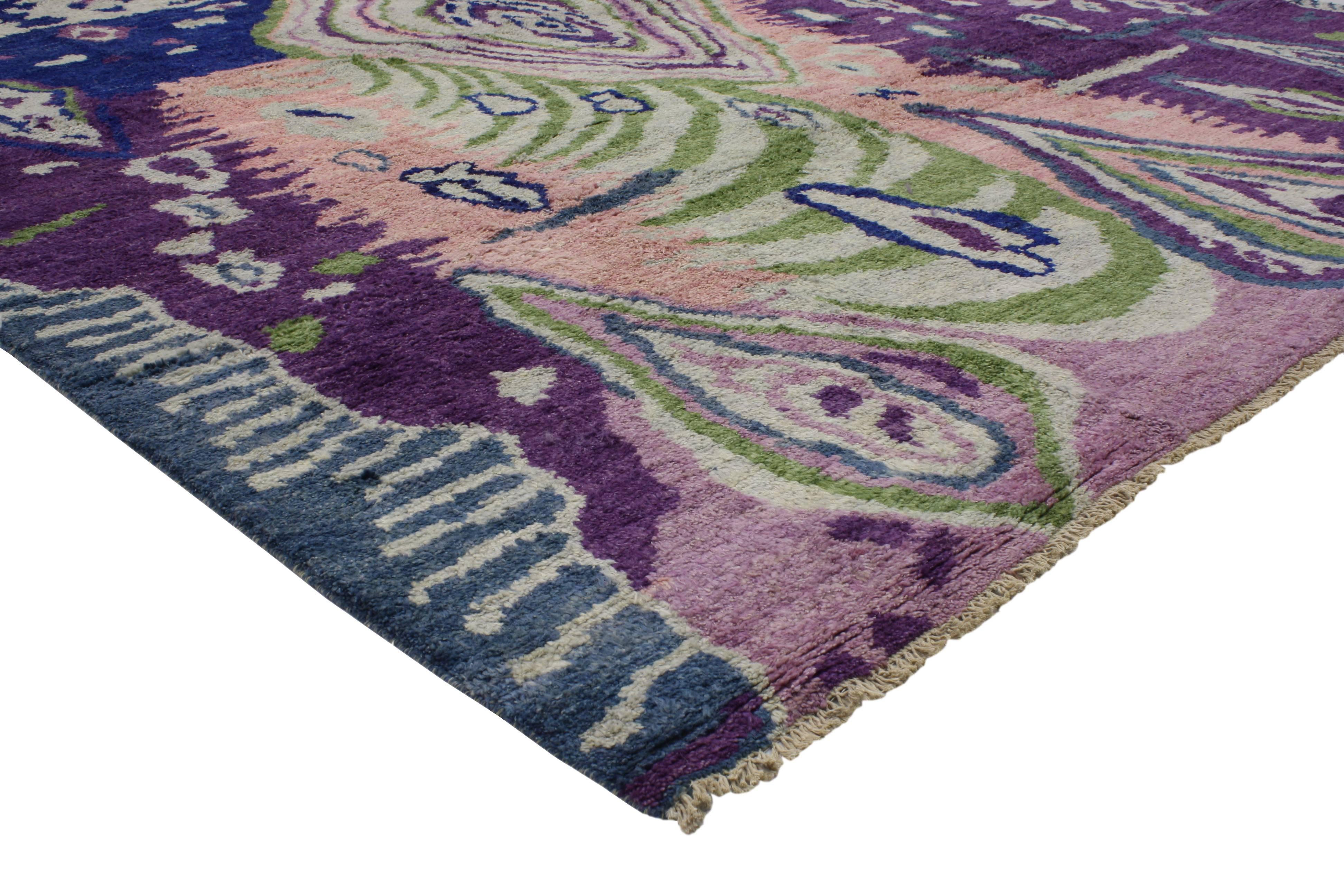 Representing a lifestyle and culture from a bygone era resonating with people today, this contemporary Moroccan style rug features a psychedelic abstract design attracting young hipsters to old hippies. Impeccably woven from hand-knotted wool in