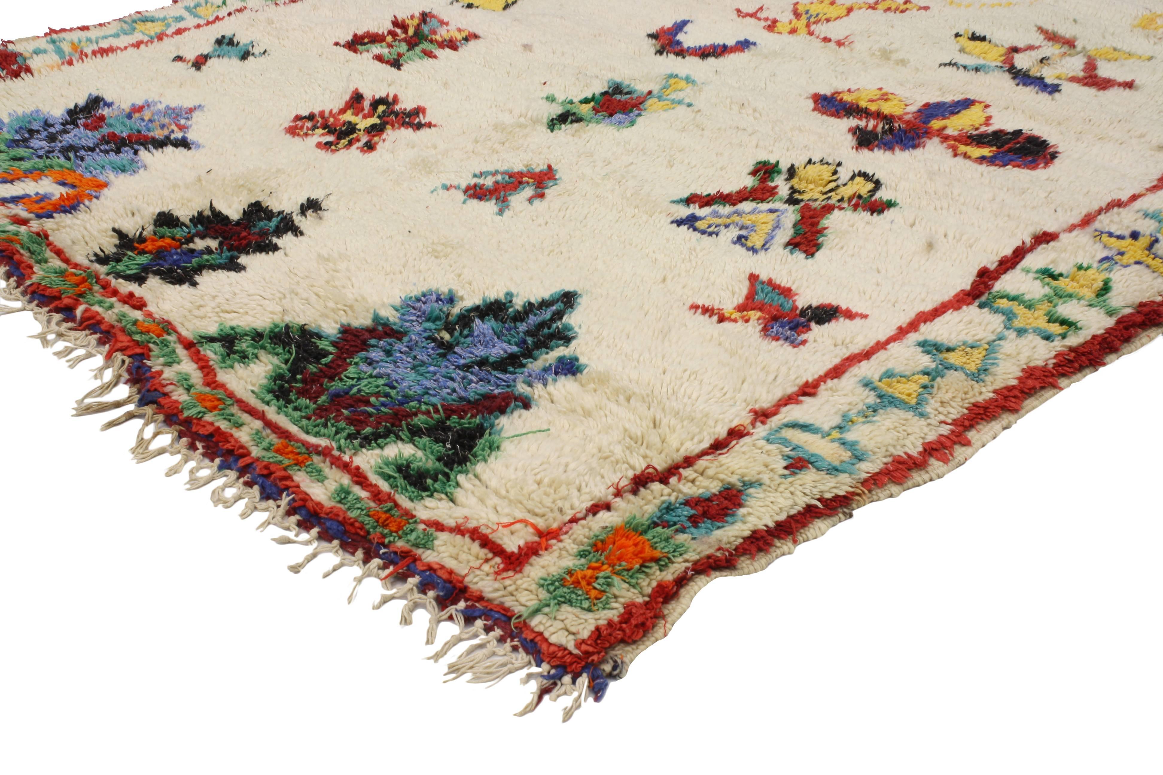 20493 Vintage Berber Moroccan Azilal Rug with Bohemian Tribal Style. This hand-knotted wool vintage Berber Moroccan Azilal rug hosts various protection and reproductive symbols that come together into a network that is both meaningful and elegant. 