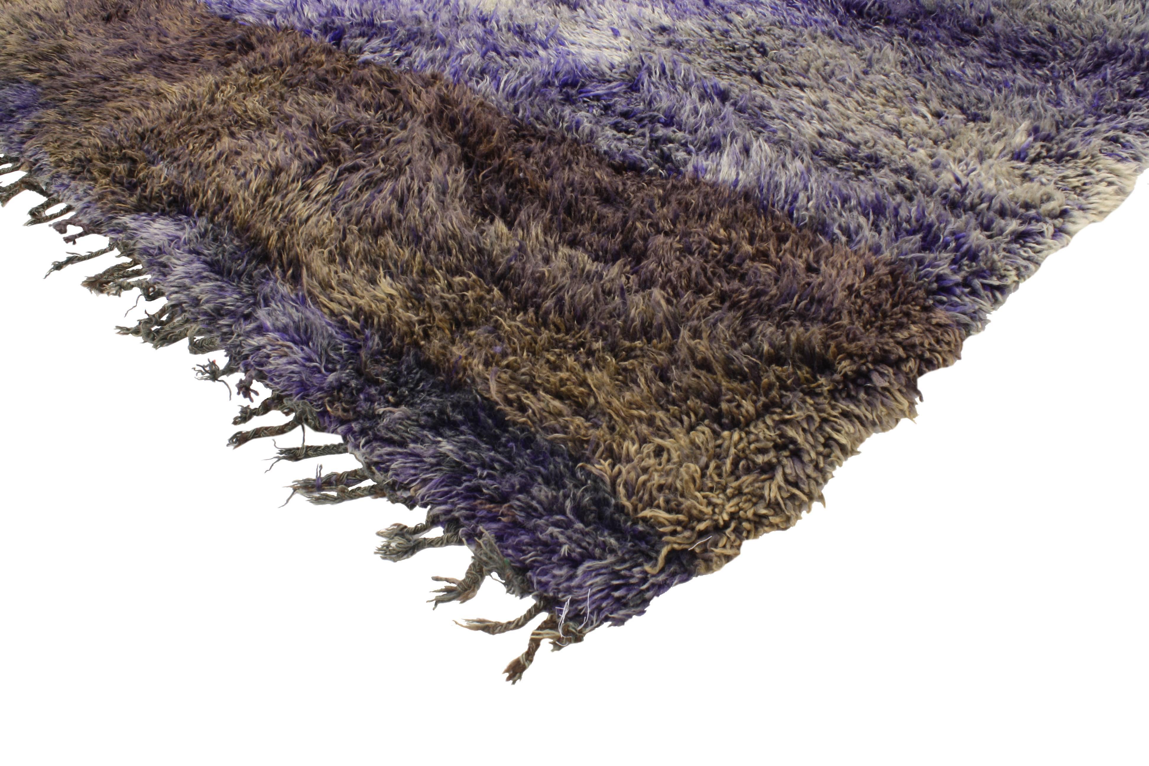 Highlighting a boho chic style with a punch of violet blue color, this striking Berber Moroccan rug will give nearly any neutral room a vibrant base. The unexpected use of violet blue creates a fantastic feast for the eyes. Rendered in a wide range