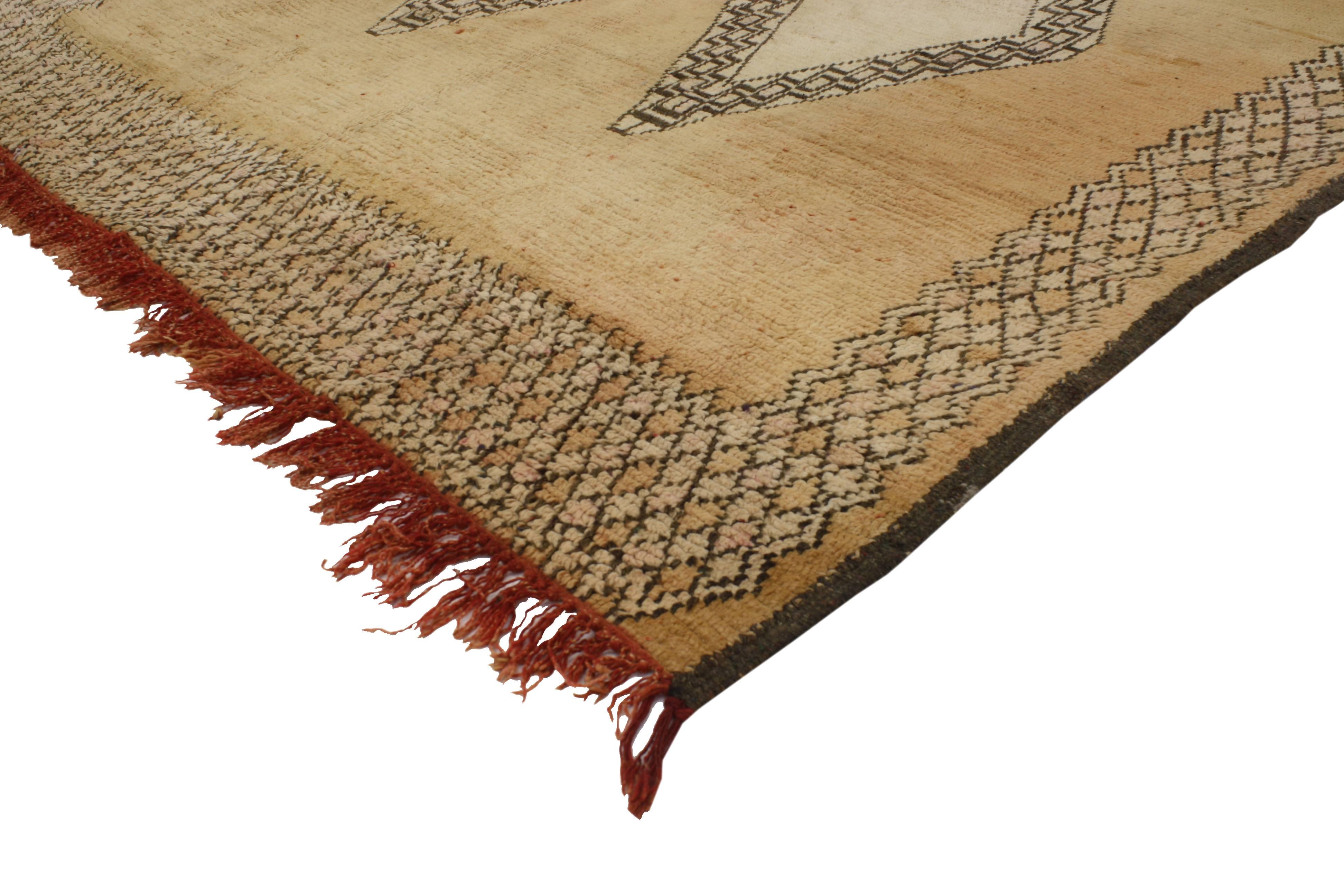 Indulge your eyes and take a break from the visual chaos with this vintage Berber Moroccan rug. Featuring a Mid-Century Modern style in monochromatic golden brown color scheme. Depicts stunning double stacked diamond medallions with an intrinsic