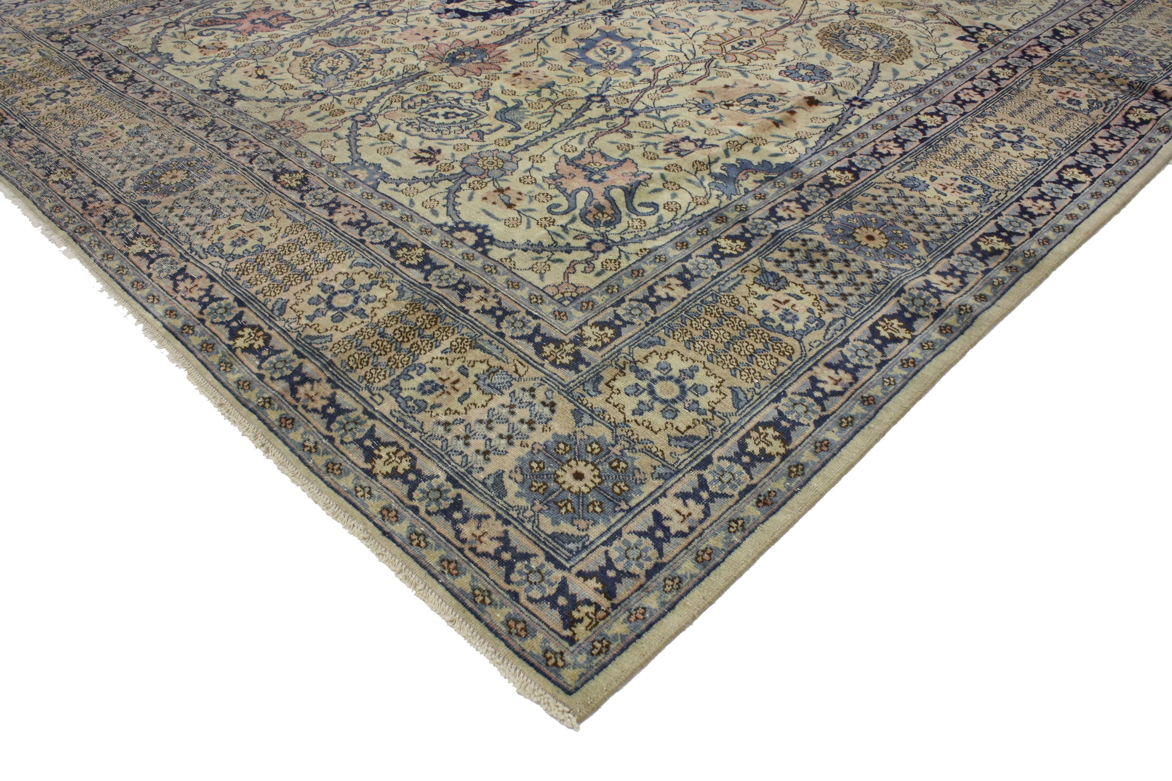 51883 Distressed Antique Persian Tabriz Rug with Georgian Romantic Chippendale Style. This early 20th century distressed antique Persian Tabriz rug with Modern Industrial style features an all-over geometric pattern surrounded by a complementary