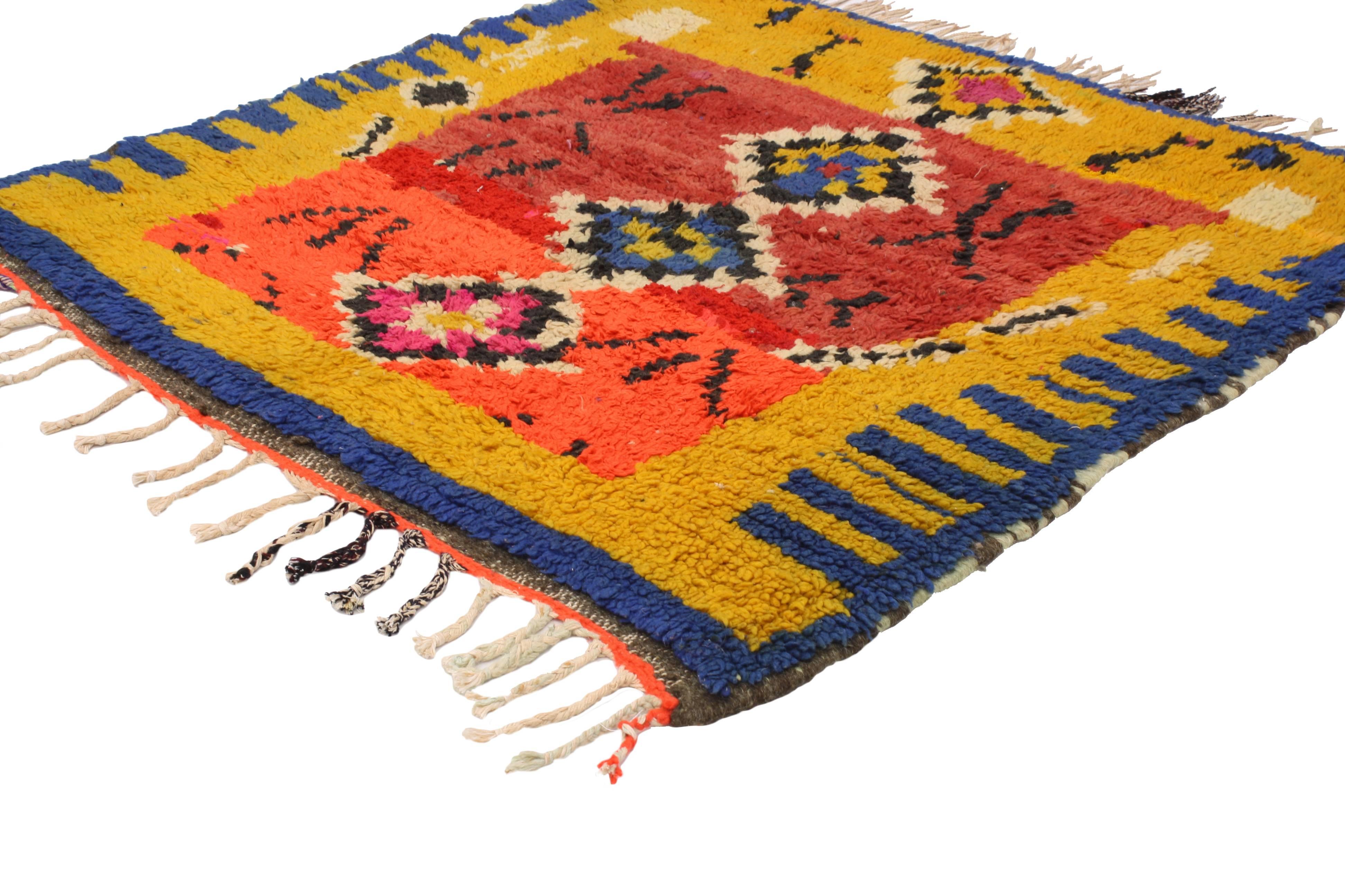 With its boho chic style and Primitive charm, this vintage Berber Moroccan rug with modern tribal design conveys a sense of beauty and mystery. Impeccably woven from hand-knotted wool in vibrant colors, this Moroccan rug does an excellent job of