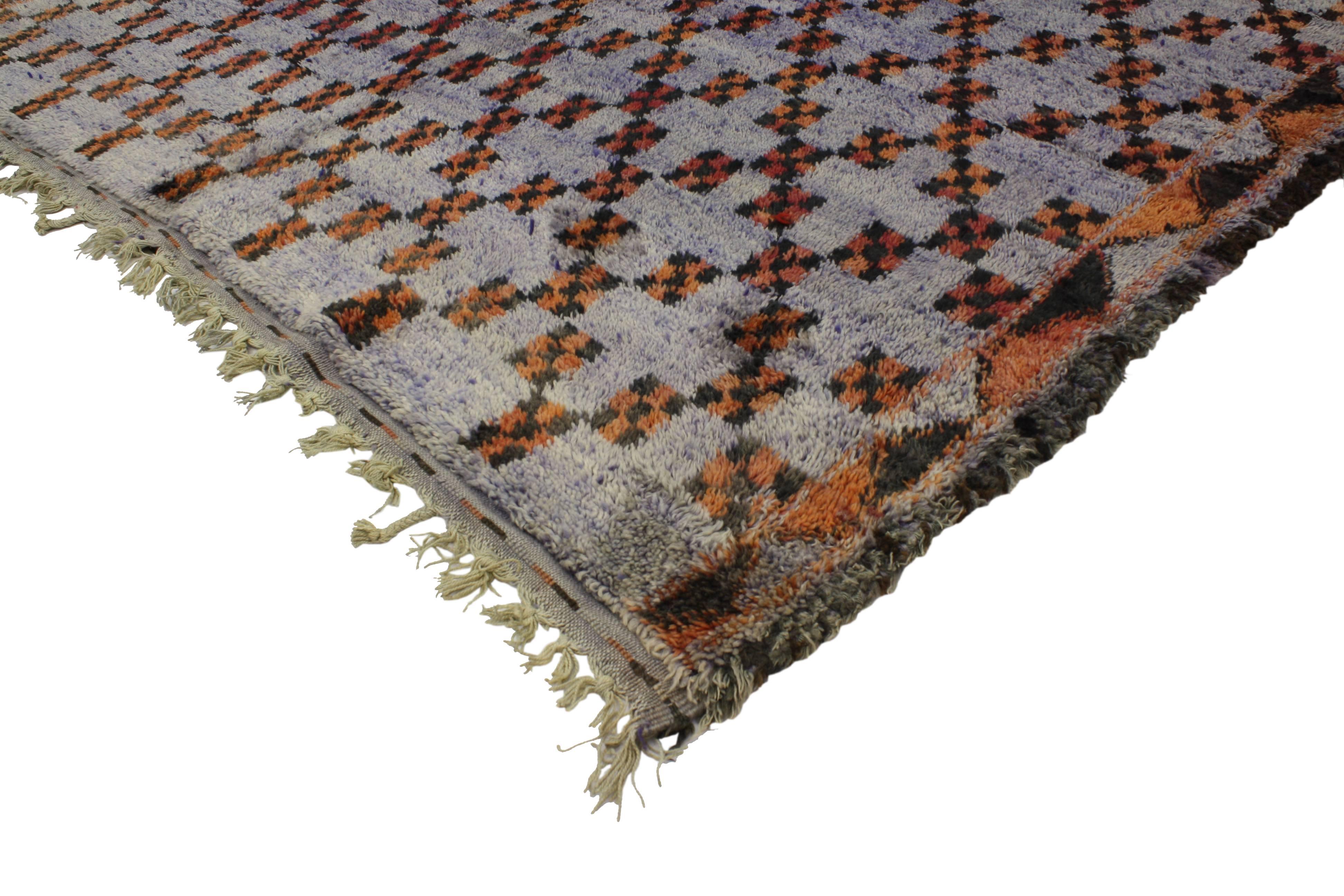 Side with pattern and texture in a modern space for a look that commits to casual elegance and comfort in this vintage Berber Moroccan rug featuring modern style. Like the country of Morocco, this Moroccan rug reflects a history rich in color and