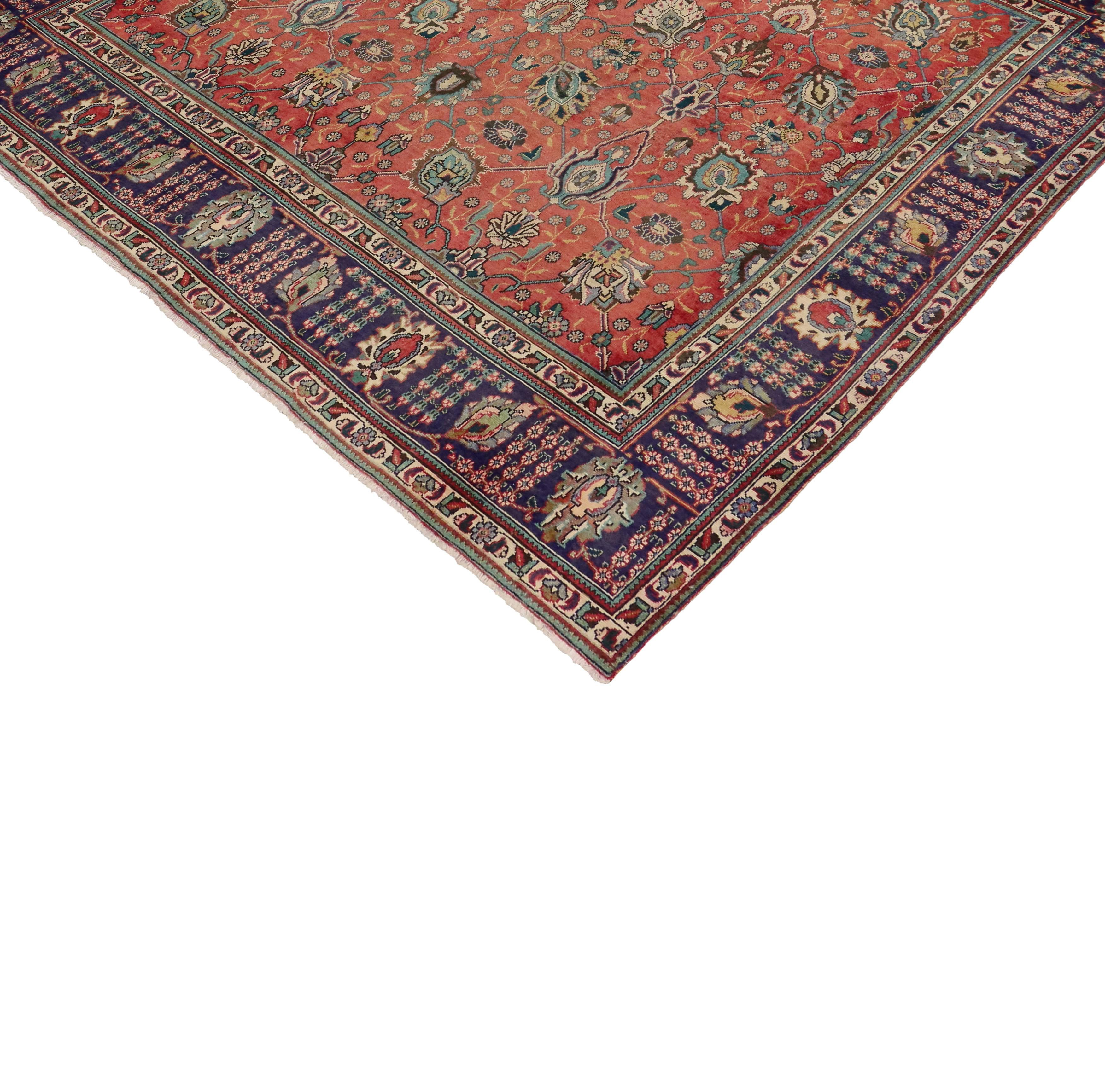 Embodying the highly decorative aesthetic, this vintage Persian Tabriz rug displays a traditional style. Featuring a tastefully casual presence and sophisticated chic style, the all-over geometric pattern resonates an astounding degree of