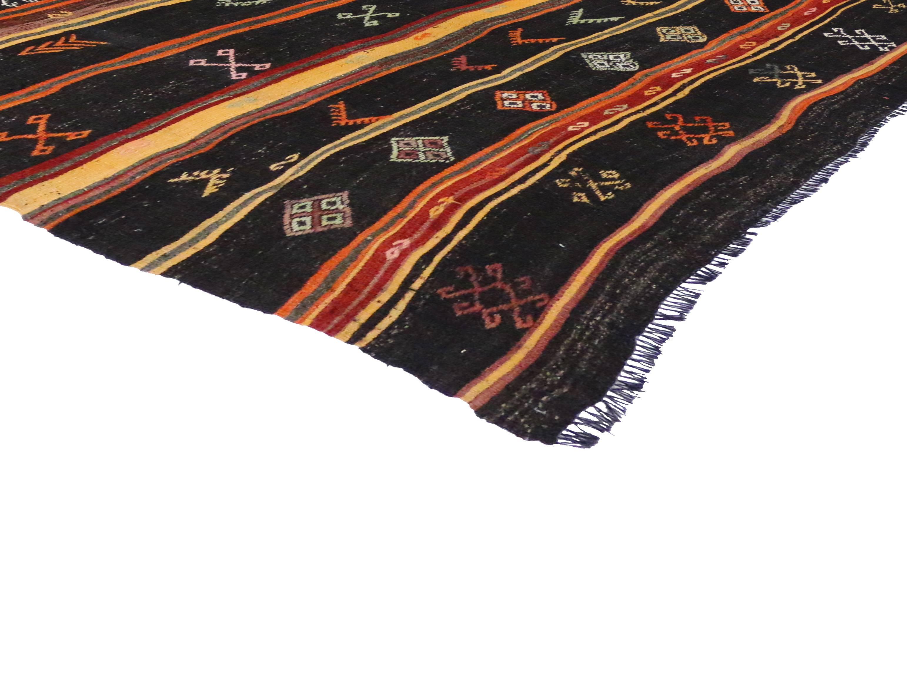 Flat-weave Kilims, like this one, are quickly growing in popularity with their warehouse chic and modern Industrial style. Here we have a vintage Turkish Kilim featuring a modern tribal design in a simplistic color palette. Highlighting a repetitive