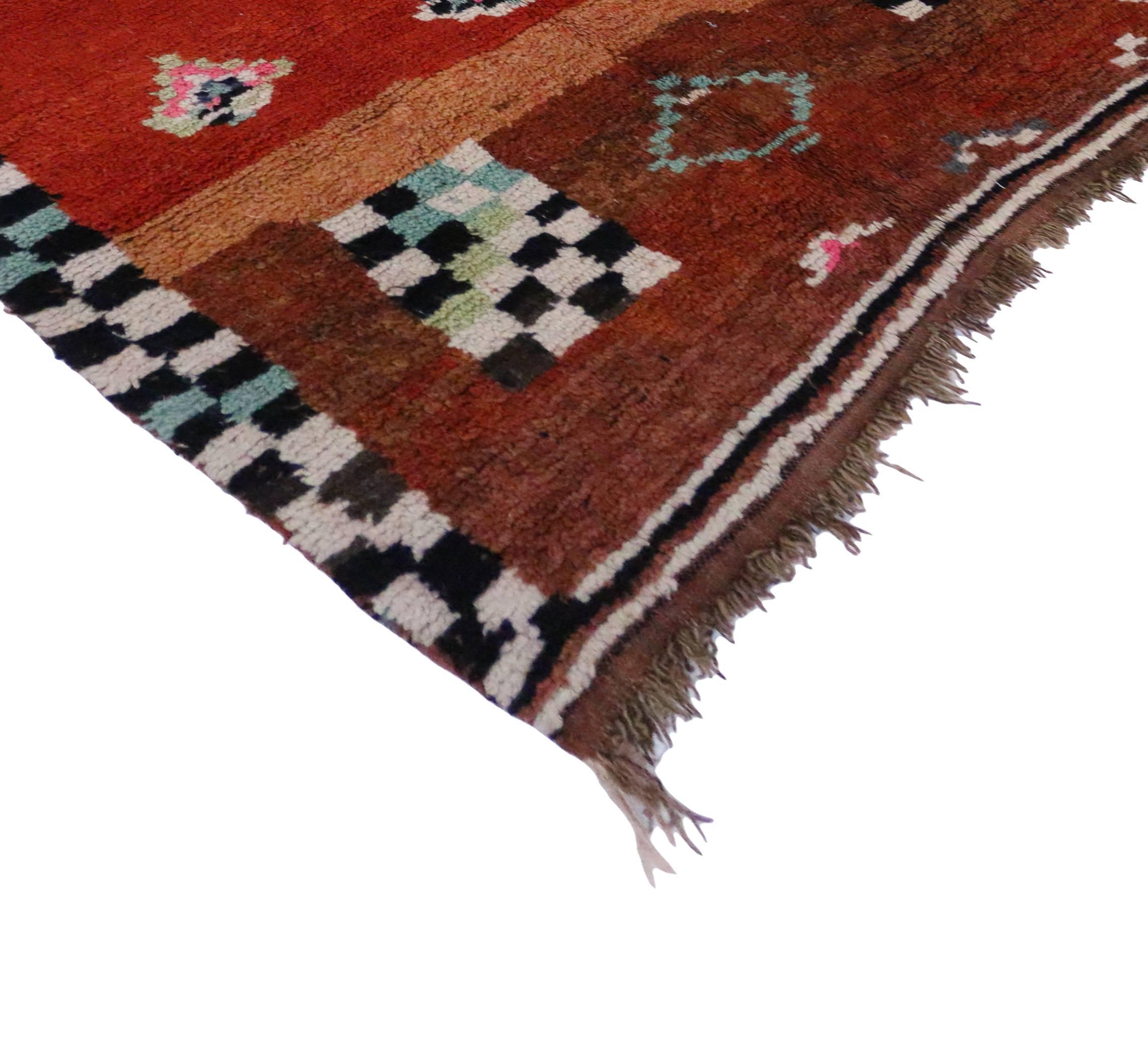 Highly stylish yet casually elegant, this boho chic Berber Moroccan rug with a contemporary abstract style is ideal for nearly any stylish space. Features a multitude of Berber Tribe motifs on an abrashed red field. This tribal design has been given