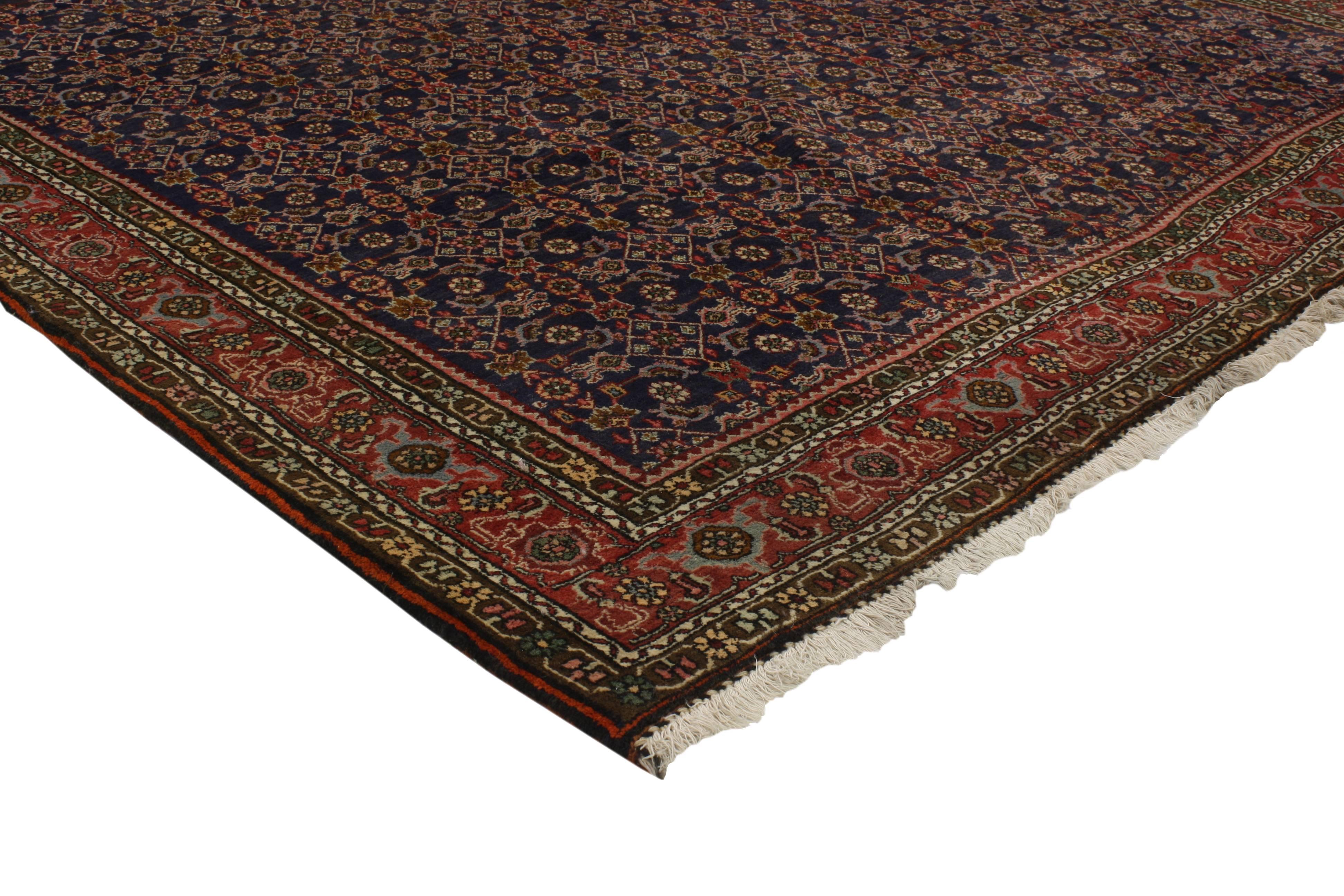 A beautifully detailed antique Bijar Persian rug features traditional modern style. This antique Bijar rug boasts an elaborate all-over Herati motif pattern, rendered in exquisite detail. The refined color palette combined with the impressive array