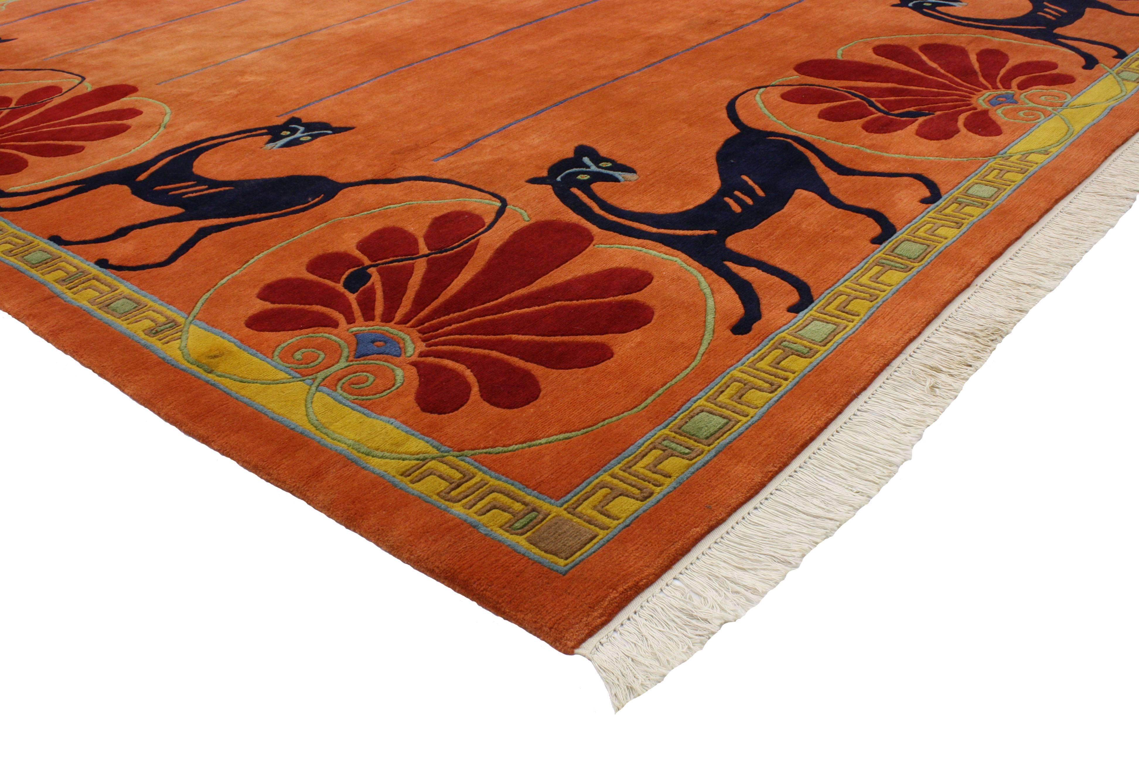 Infuse your space with this vintage Tibetan orange rug with black cats. Combining the ancient Tibetan art with contemporary design, this fashion-forward contemporary rug from Tibet will add much-needed color and texture. Featuring four black