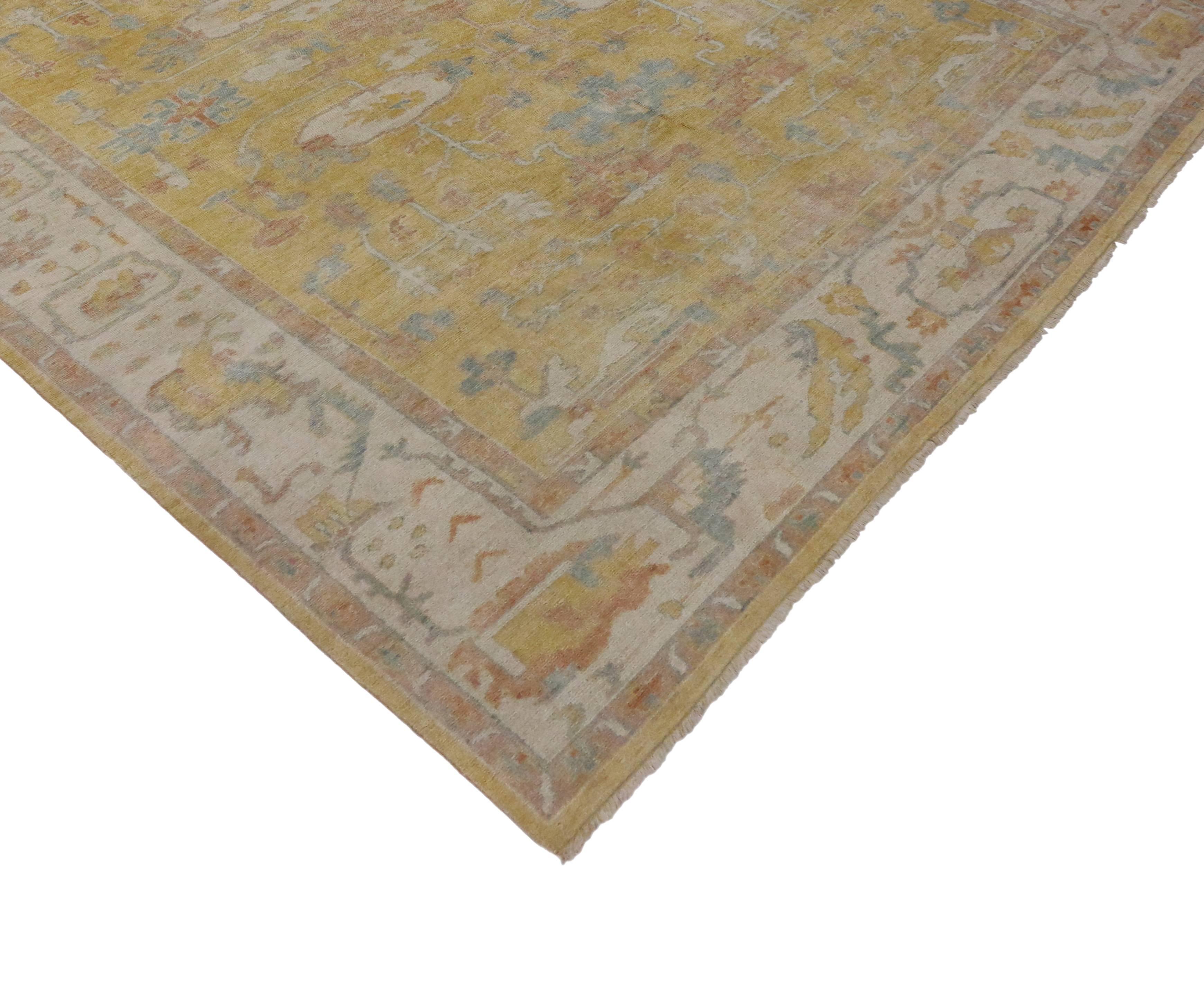 Infuse your favorite room in the house with the soft, warm glow from this modern yellow Oushak rug. Features a transitional style with a golden yellow field surrounded by geometric motifs and a low contrasting beige border. Color palette consists of