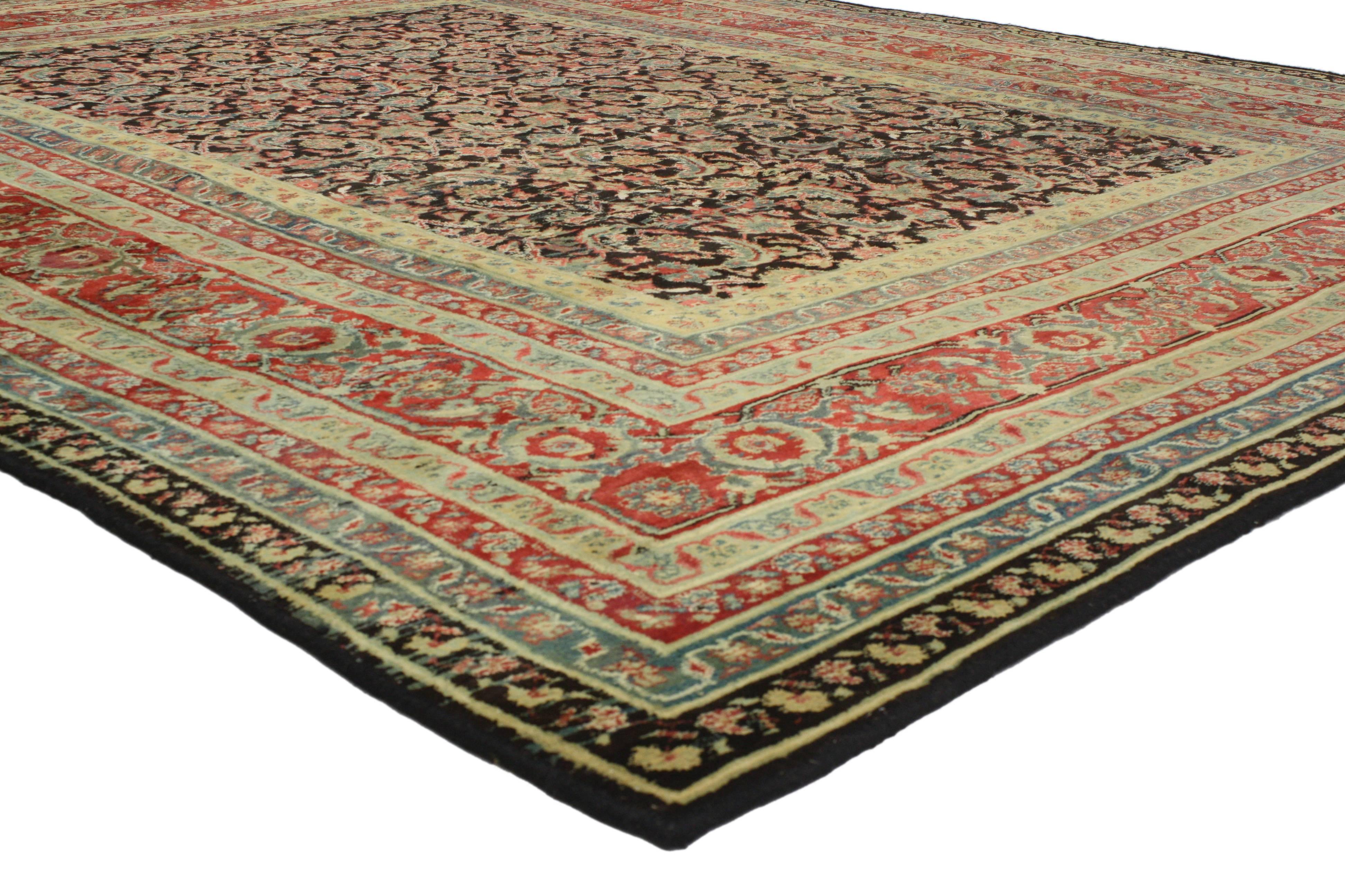 Intriguing, appealing and beautifully designed, this vintage Indian Agra rug with modern traditional style showcases some of the finer points when it comes to Indian culture. Features an all-over and repetitive geometric pattern on an abrashed black