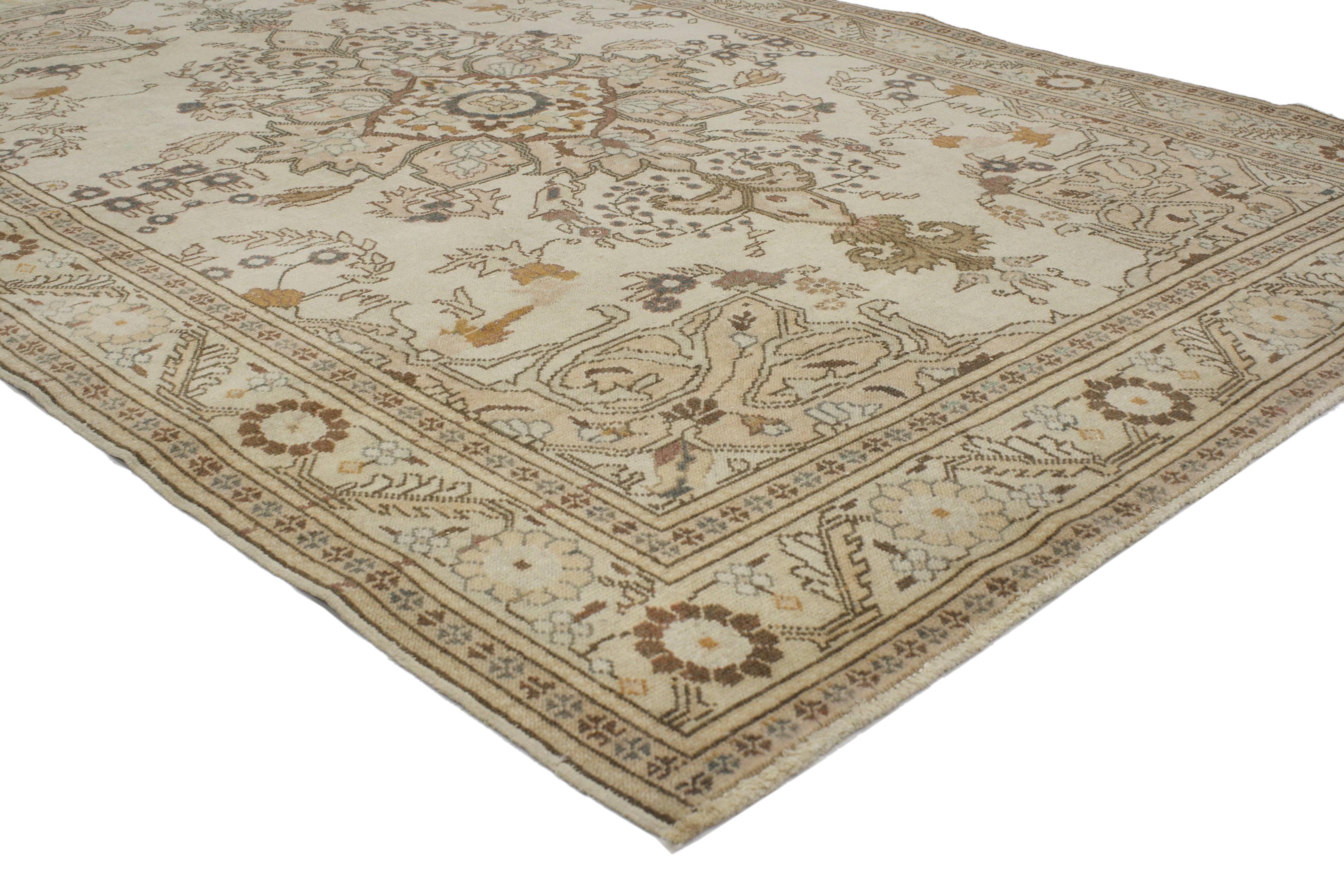 Providing an element of comfort, artistic statement and functional versatility, this vintage Turkish Sivas rug creates a soothing elegance and quiet sophistication. With its transitional style in light colors, this vintage Turkish rug features a