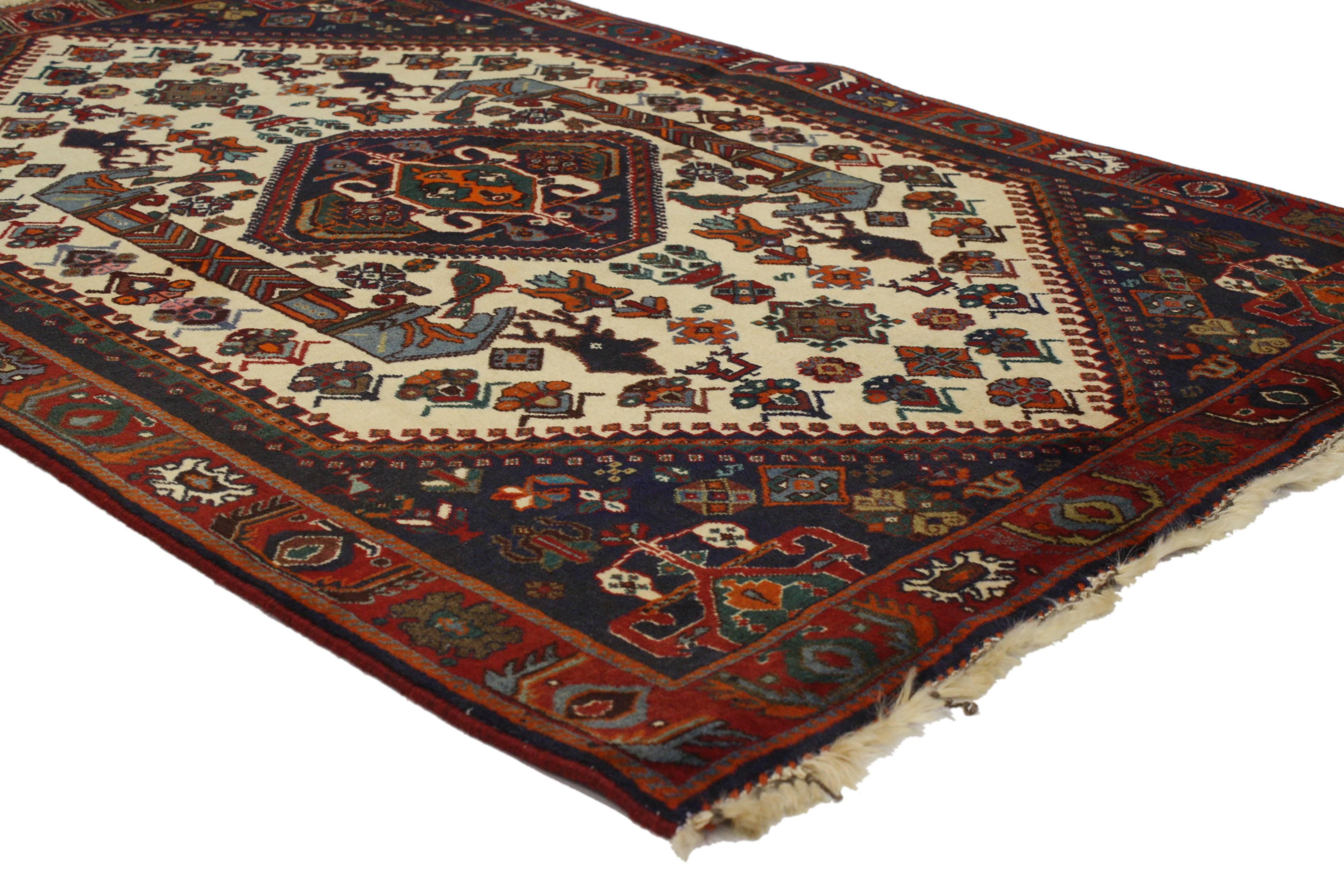 76992 Vintage Persian Shiraz Rug with Modern Tribal Style 03'05 x 04'10. Cleverly composed with modern tribal style, this hand-knotted wool is a captivating vision of woven beauty. The beige field features a central scarab medallion flanked with a