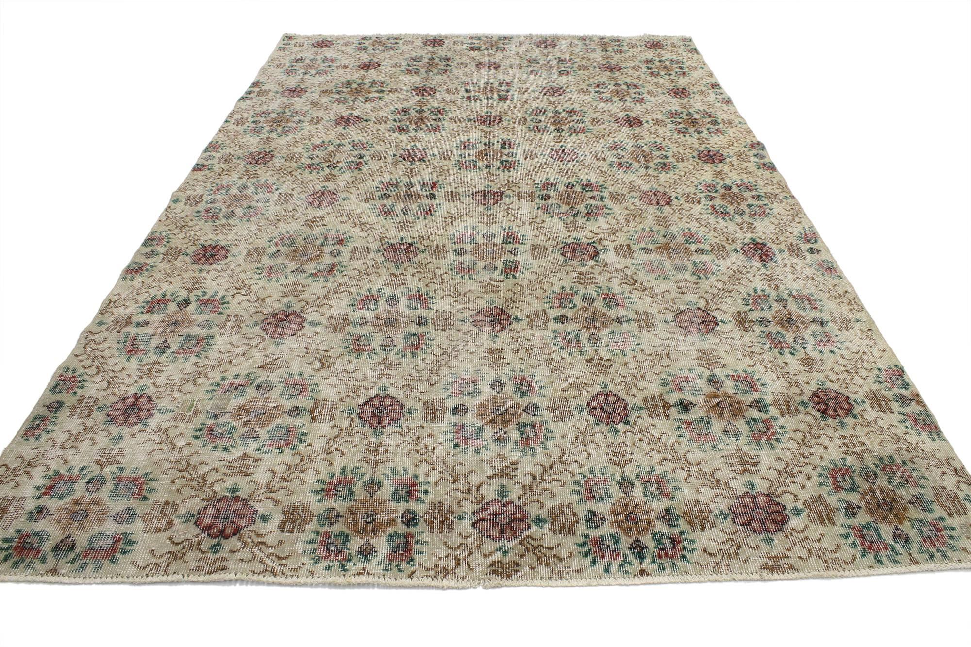 52024 Distressed Vintage Turkish Sivas Rug with Romantic English Cottage Style 06'05 x 09'07. With a Classic floral lattice pattern and traditional feel, this hand knotted wool distressed vintage Turkish Sivas rug beautifully embodies romantic