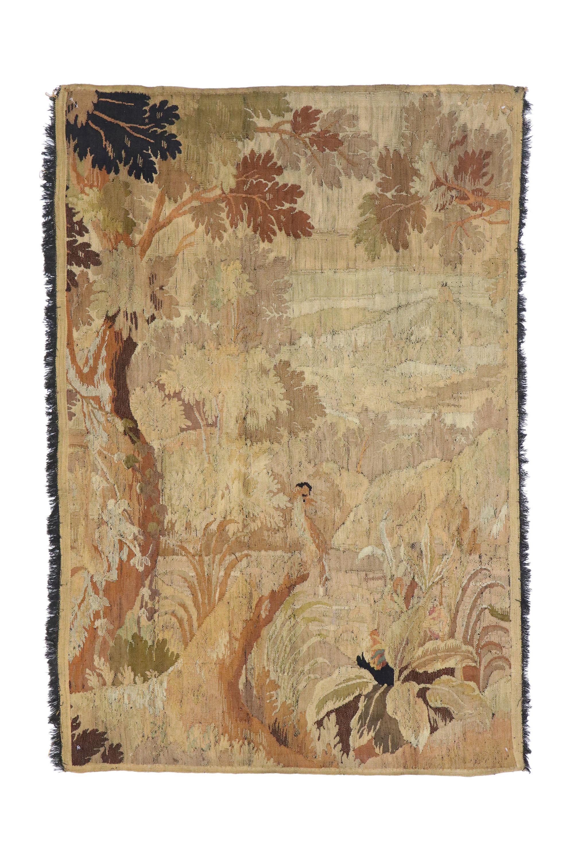 76959 antique French tapestry wall hanging with landscape scene and old world charm. This handwoven wool antique French Aubusson verdure tapestry is well-loved featuring a landscape scene with old world charm and French Provincial appeal. Among the
