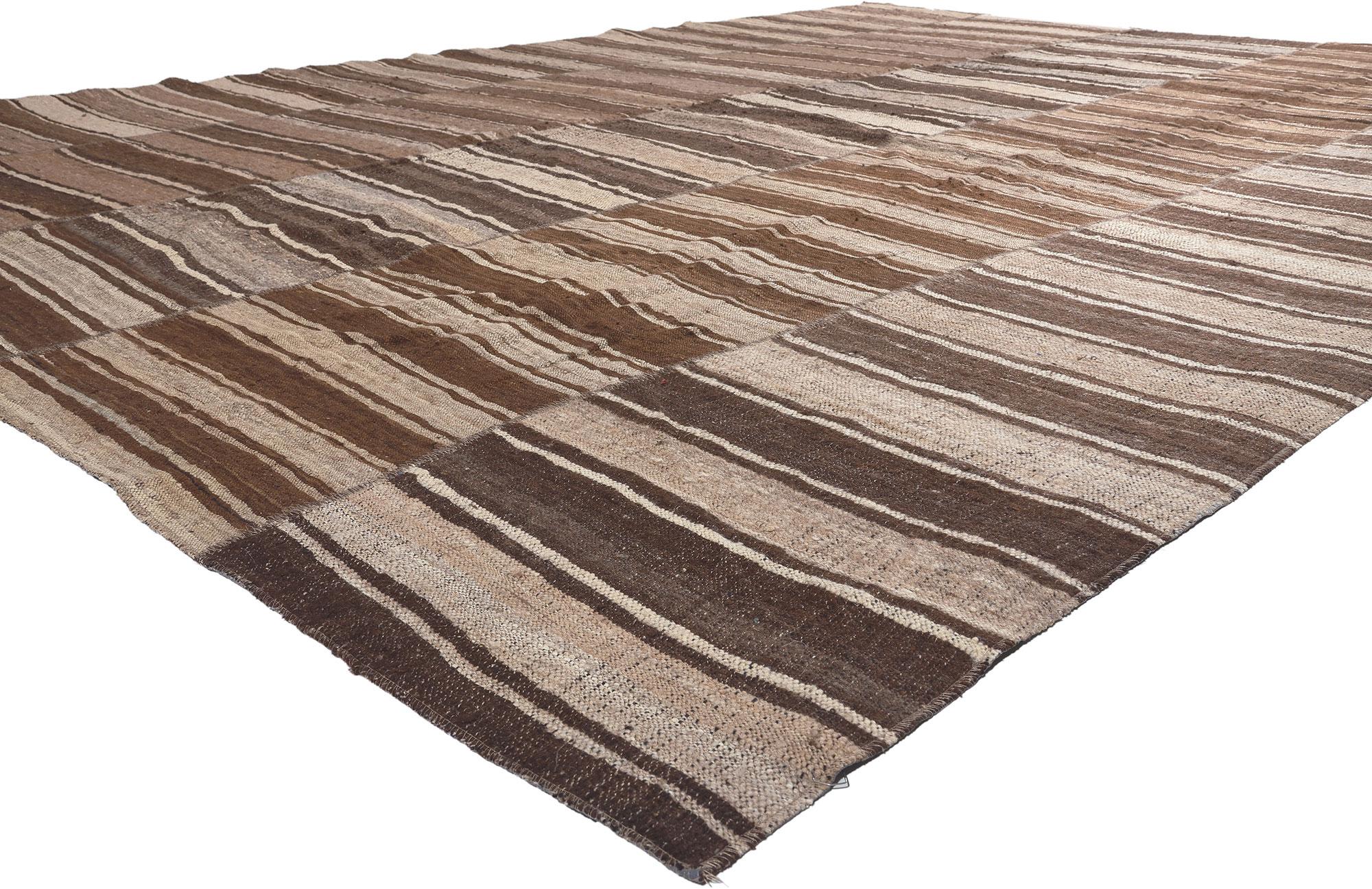 60633 Brown Vintage Striped Turkish Kilim Rug, 10'09 x 14'03. In the crafting of this vintage Turkish kilim rug, the spirit of Wabi-Sabi seamlessly entwines with sustainable design, resulting in a masterpiece that harmoniously fuses rustic charm