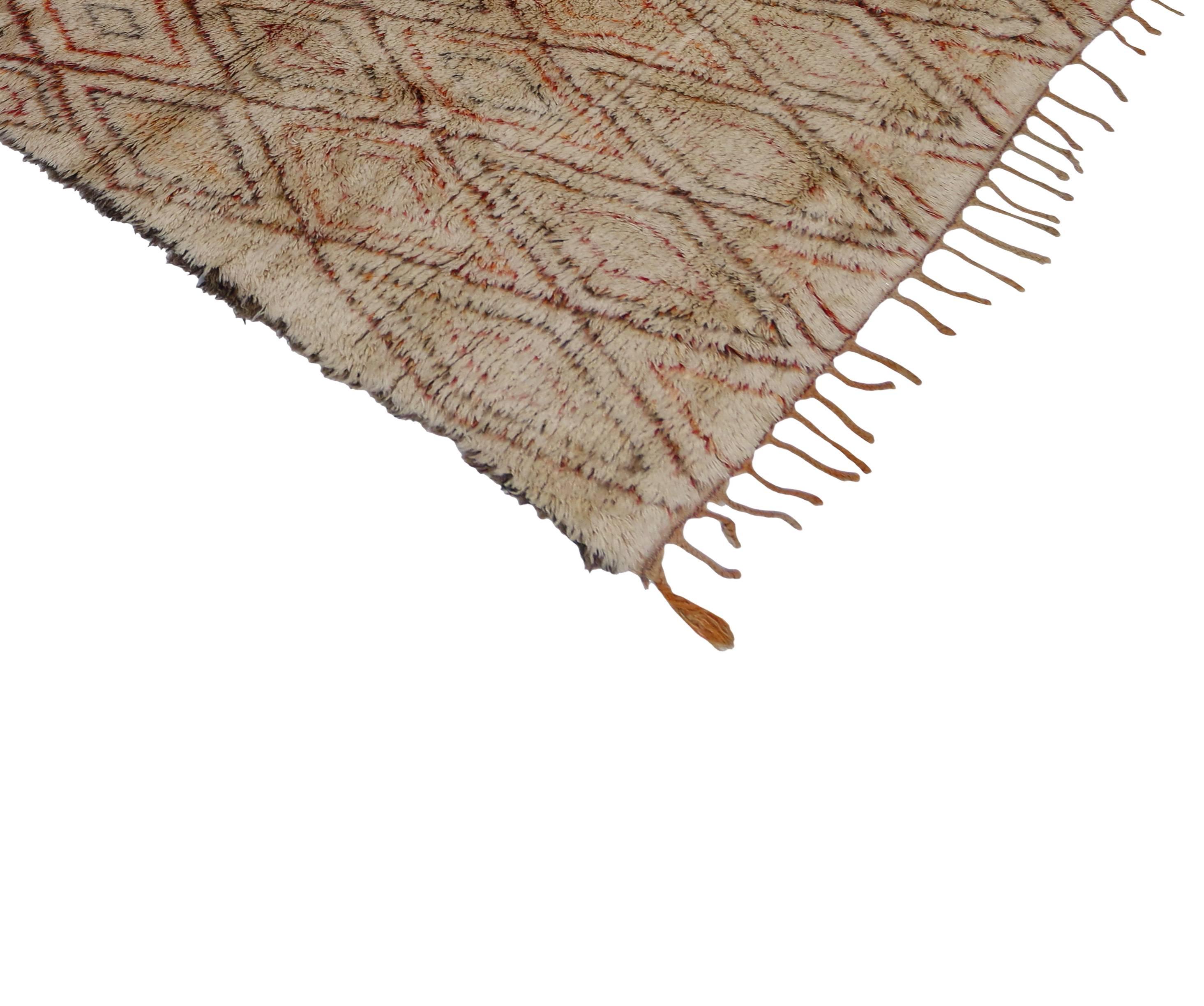 With its strong linear lines and lozenge motifs based on ancient traditions, this Berber Moroccan rug is believed to protect the human spirit from negative energy and shield the human body from the elements. Moroccan rugs are prized for their