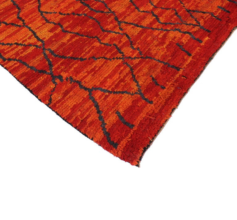 74822 Vintage Berber Moroccan Rug with Post-Modern Design and Vibrant Colors. This hand-knotted wool vintage Berber Moroccan rug features a post-modern style in vibrant colors. The orange and red hues complement each other while allowing the strong