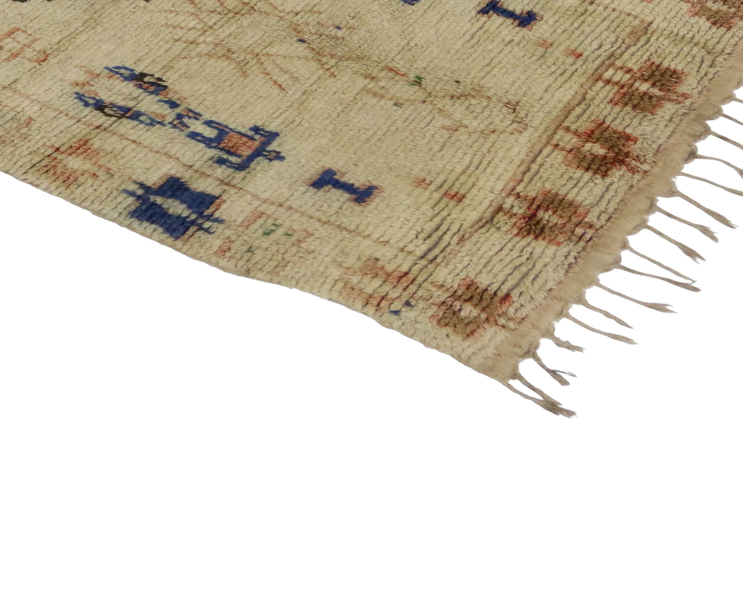 Add a tribal touch to your home with this vintage Moroccan carpet runner from the Azilal region. This runner was handmade by the women of the Azilal province in the High Atlas Mountains of Morocco. With their thick pile and dense construction, these