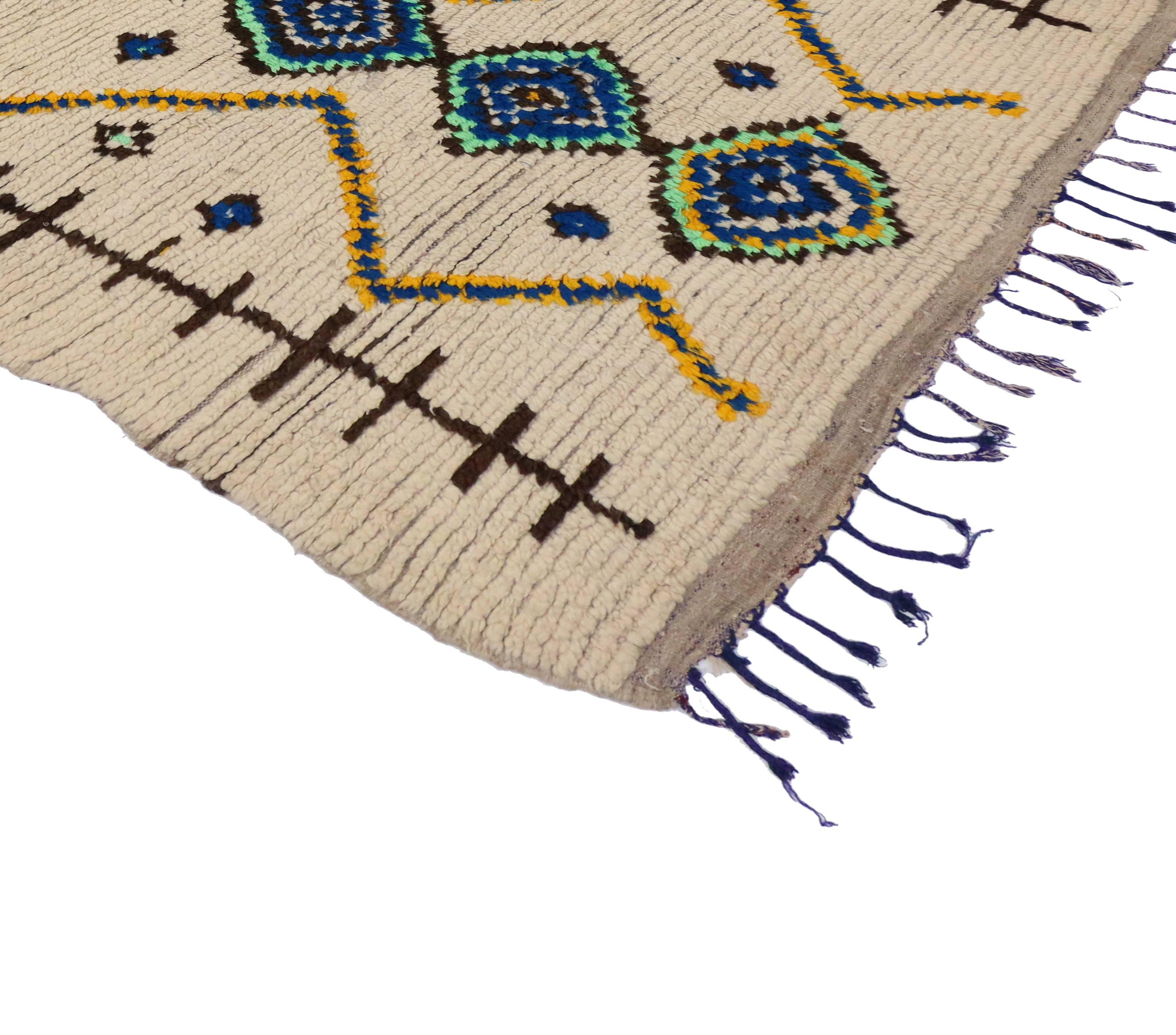 Moroccan rugs from the Azilal region are notable for their dynamic colorful designs and for their strong sense of geometric structure. With their tribal motifs and eccentric accents, Berber Moroccan rugs are believed to protect the human spirit from